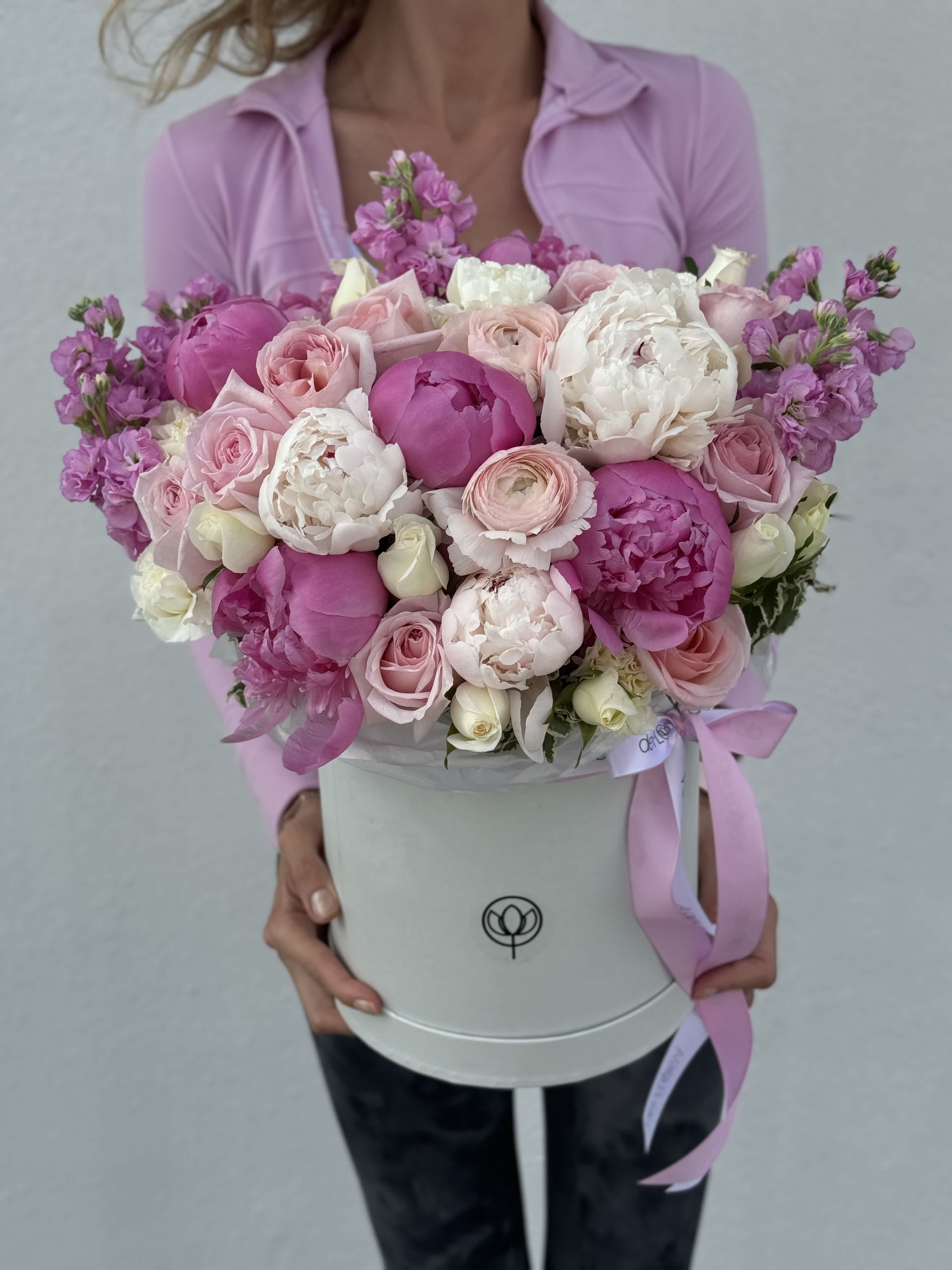 Large pink and white bouquet in a round white box