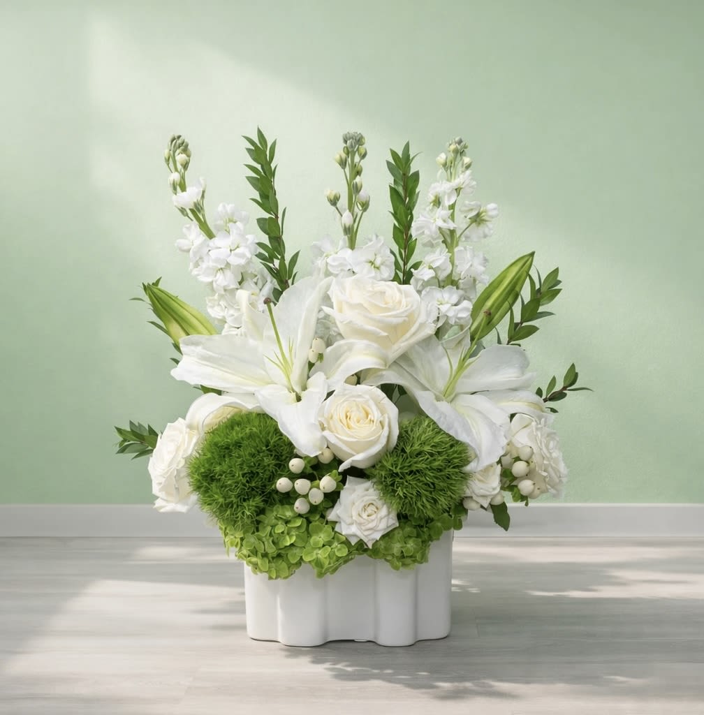 Pearl Blossoms - This gorgeous white and green arrangement brings instant elegance to your space with fresh roses, lilies, and more blooms.