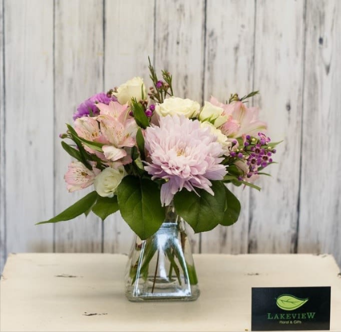 Pink and white mixed bouquet in a clear glass vase