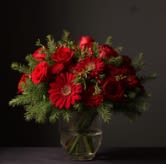 Lush n Love - This lush n lovely bouquet is a beautiful way to say I love you.  The bouquet will have minimum of 9 red roses with red gerbera and Christmas pine (yes real, yes fresh)