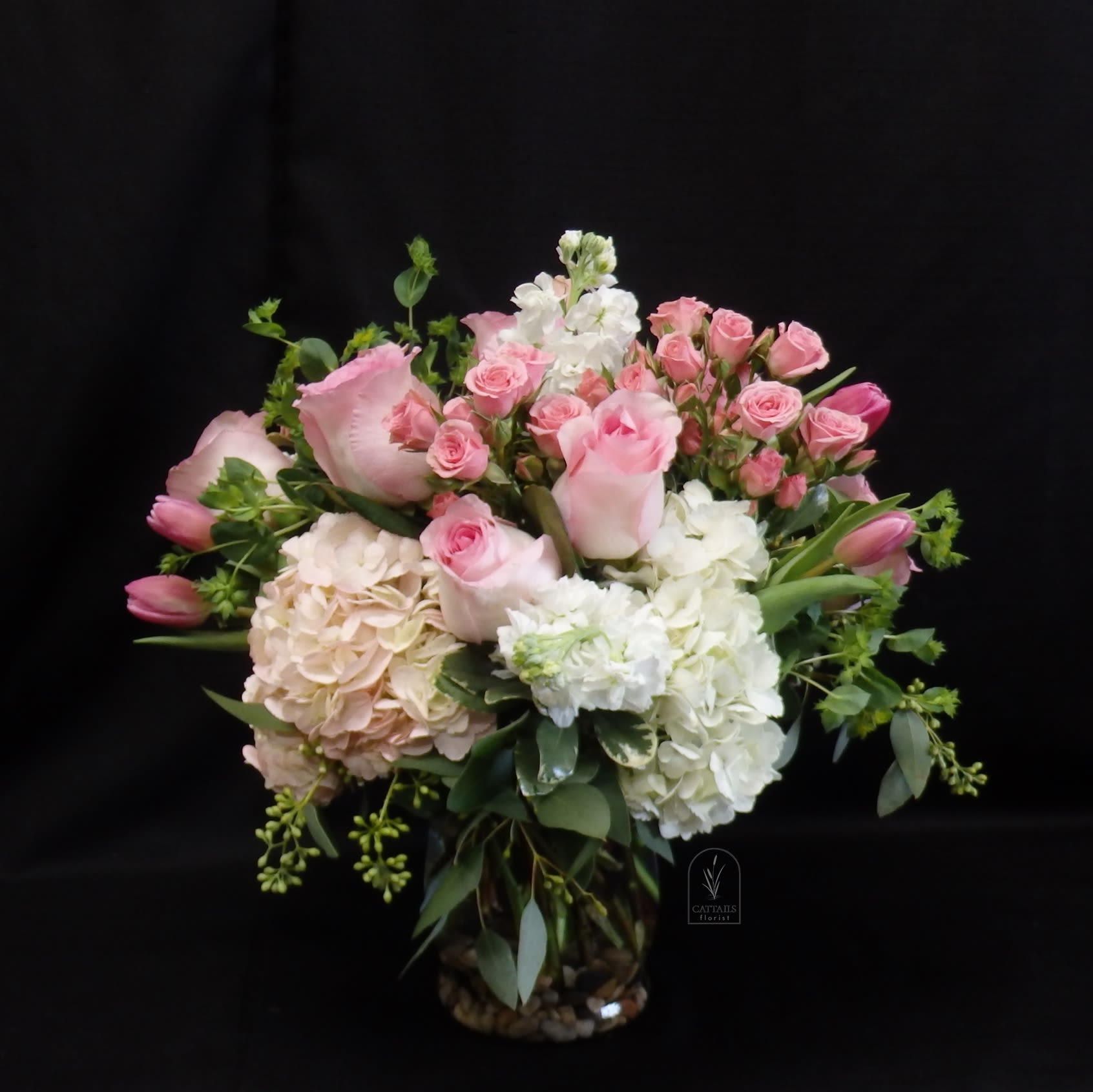 Pretty Woman - Soft, garden-fresh and undeniably romantic-the Pretty Woman arrangement is a lovely choice for an anniversary, mother's day, a birthday surprise, or a thoughtful "just because" gift. The gentle mix of pink and white blooms reads feminine and elegant, the kind of bouquet that will make the person you're celebrating feel truly seen and cherished. This rounded, full design pairs pink roses and spray roses with hydrangeas, pink tulips and stock. This arrangement sends a warm, affectionate message without saying a word. 