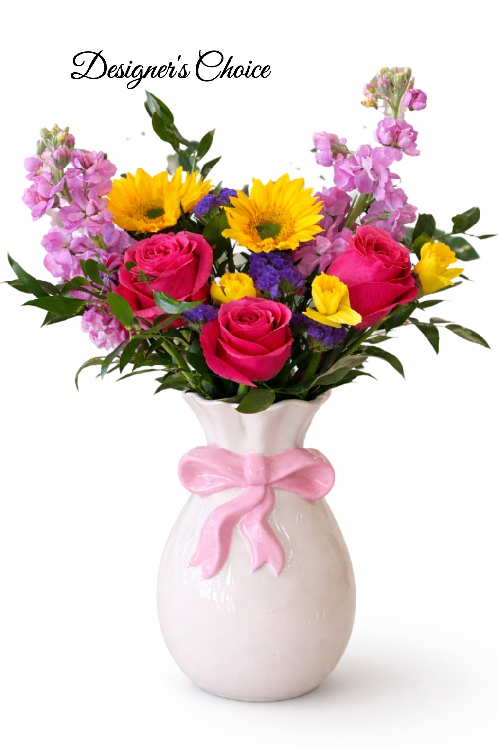 Bright mixed bouquet with pink roses, yellow sunflowers and purple blooms in a white vase with pink bow