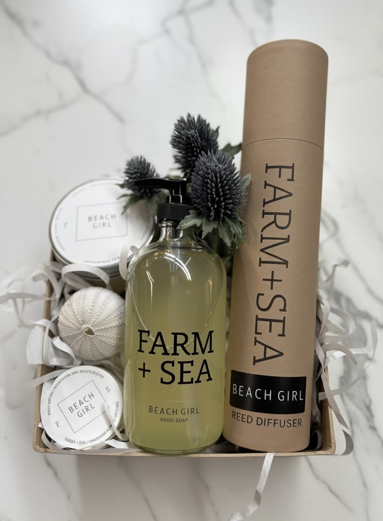 Beach Girl Favorites  - Escape to a summer day at the beach with Farm + Sea's Beach Girl Fragrance - our shop favorite. This set includes a large candle, 2 oz body lotion, hand soap and reed diffuser all wrapped up in our signature Kraft box with a selection of nautical accents. 