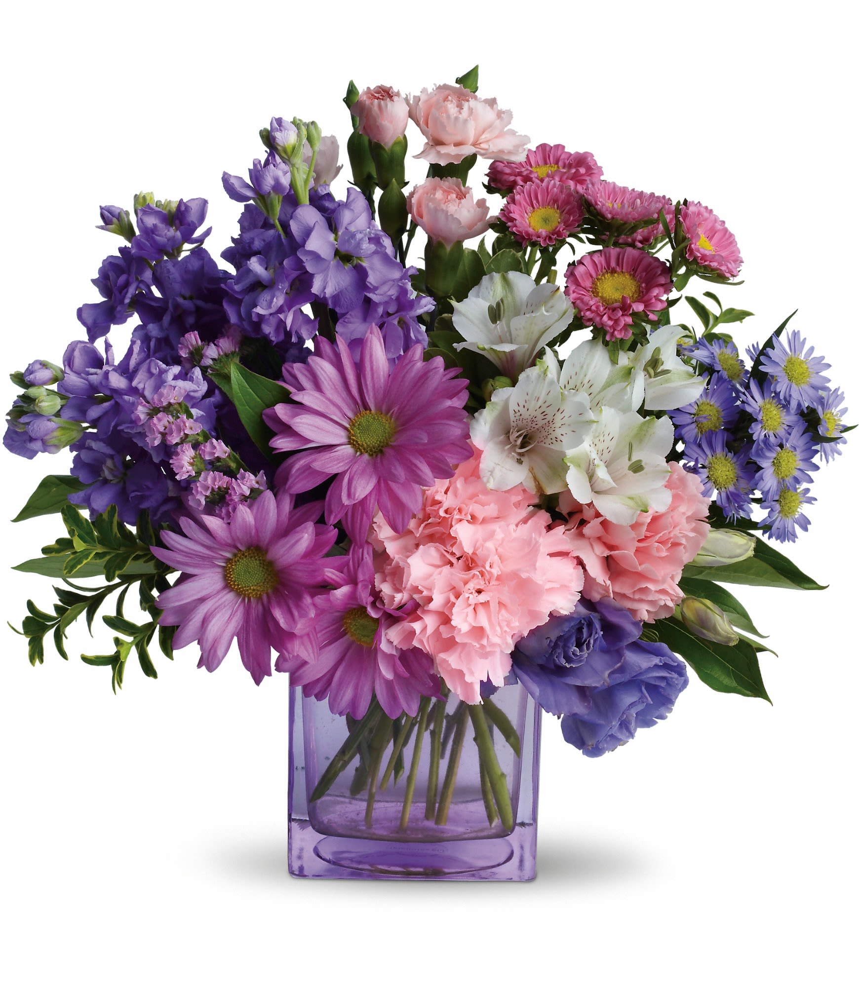 Mixed bouquet of purple, pink, and white flowers in a purple glass vase