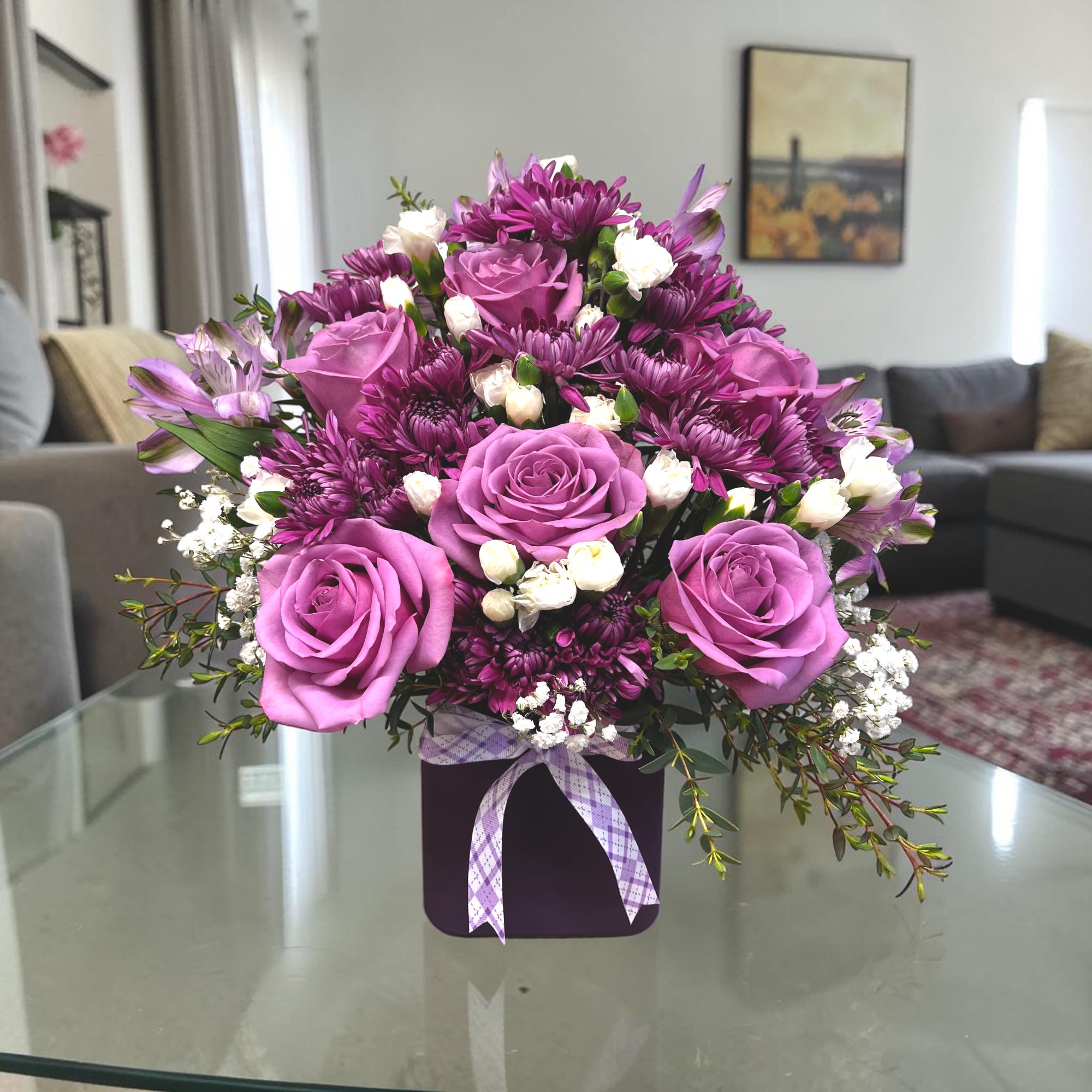 Perfectly Purple - This monochromatic purple arrangement is perfect for any event ranging from a get well to a housewarming gift to a friend to a birthday surprise!   Approximate Dimensions: 10"D x 10"H