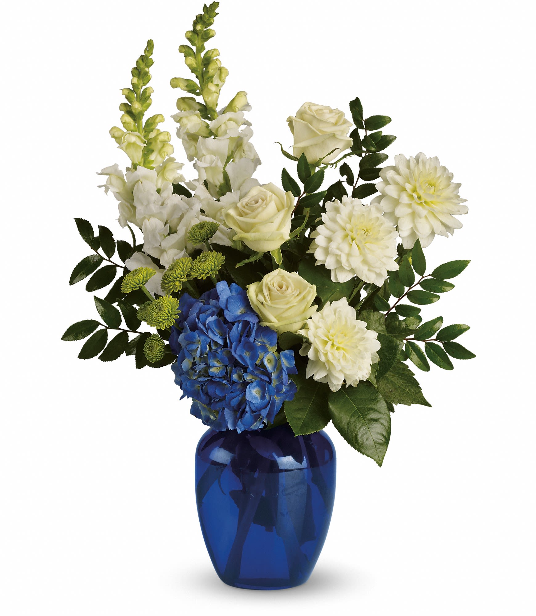 White and blue floral arrangement in a cobalt glass vase