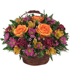 Just for Her - Lovely rounded centerpiece arrangement in a handled basket featuring beautiful roses, alstroemeria and assorted delicate pink and mauve flowers. Expertly arranged by a professional floral designer and delivered fresh to the door.
