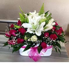 Red rose and white lily arrangement - Lovely arrangement with pure white lilies and spicy red roses to send for the memorable occasion.
