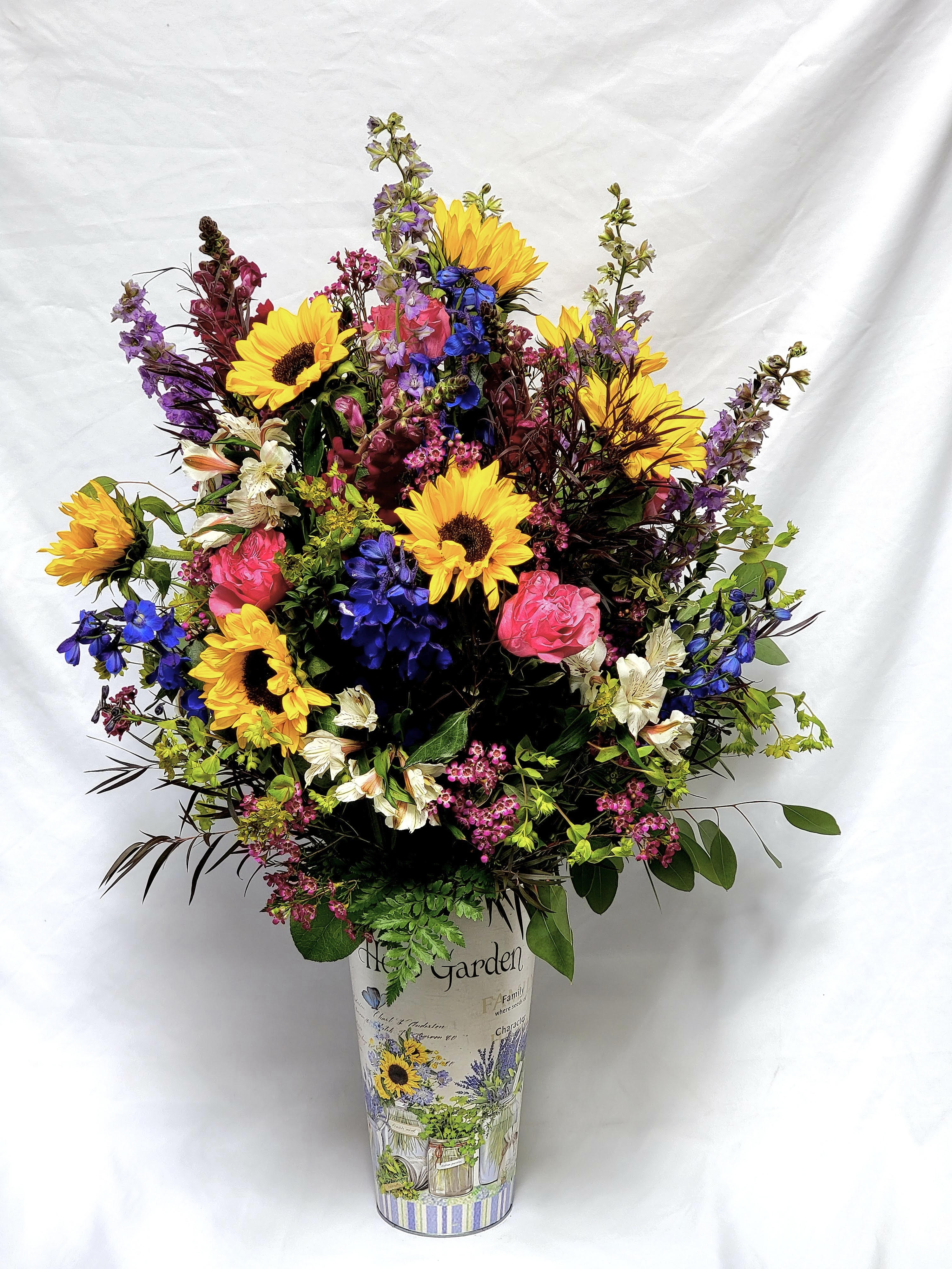 Wonderful Spring - This grand arrangement features sunflowers, brightly colored roses, snapdragons, alstromeria and more!