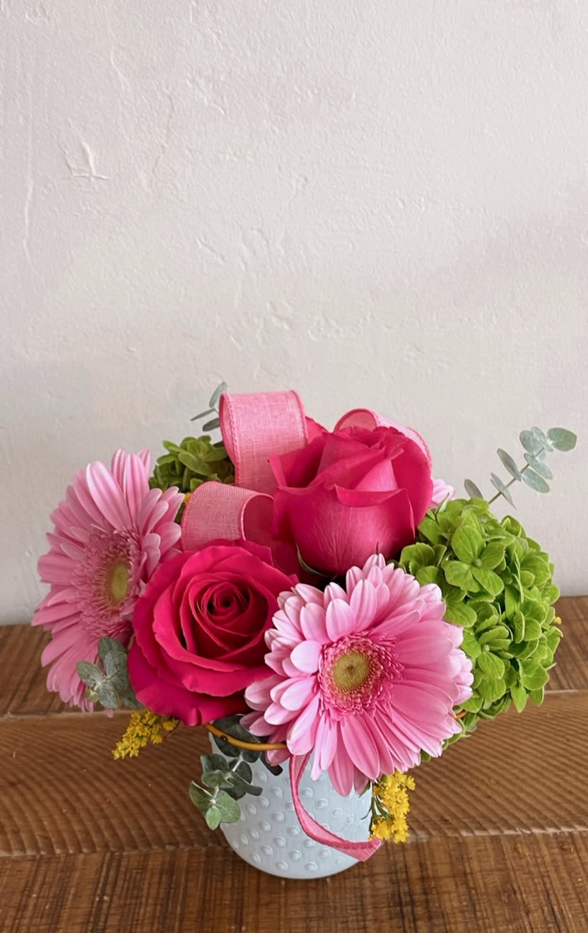 Precious Thoughts - Hot pink roses paired with pale pink gerbera daisies and bright green hydrangea make this compact flower arrangement a lively, feminine choice for your Mother's Day gift,  a birthday bouquet, a thank-you gift, or a spring celebration. The color mix-saturated pinks, fresh greens,  -reads playful and joyful, the kind of arrangement that will make the person you're thinking of smile as soon as they see it.  .