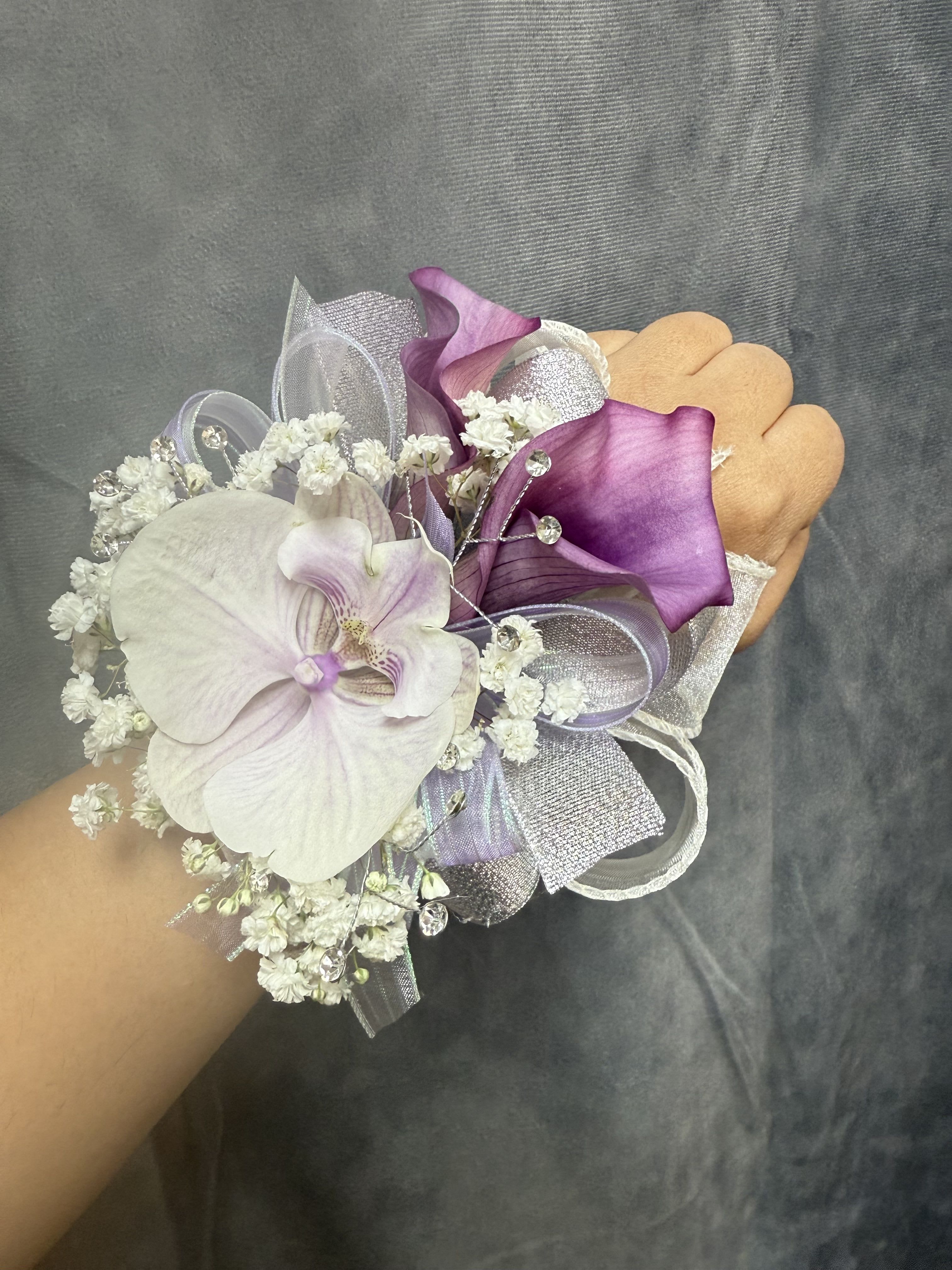 Purple lavender calla lilies corsage - Purple calla lilies and lavender orchids, rhinestone picks and layered ribbons-an elegant pearl band wrist corsage perfect for prom or other dressy celebrations. The corsage can b customized upon request 