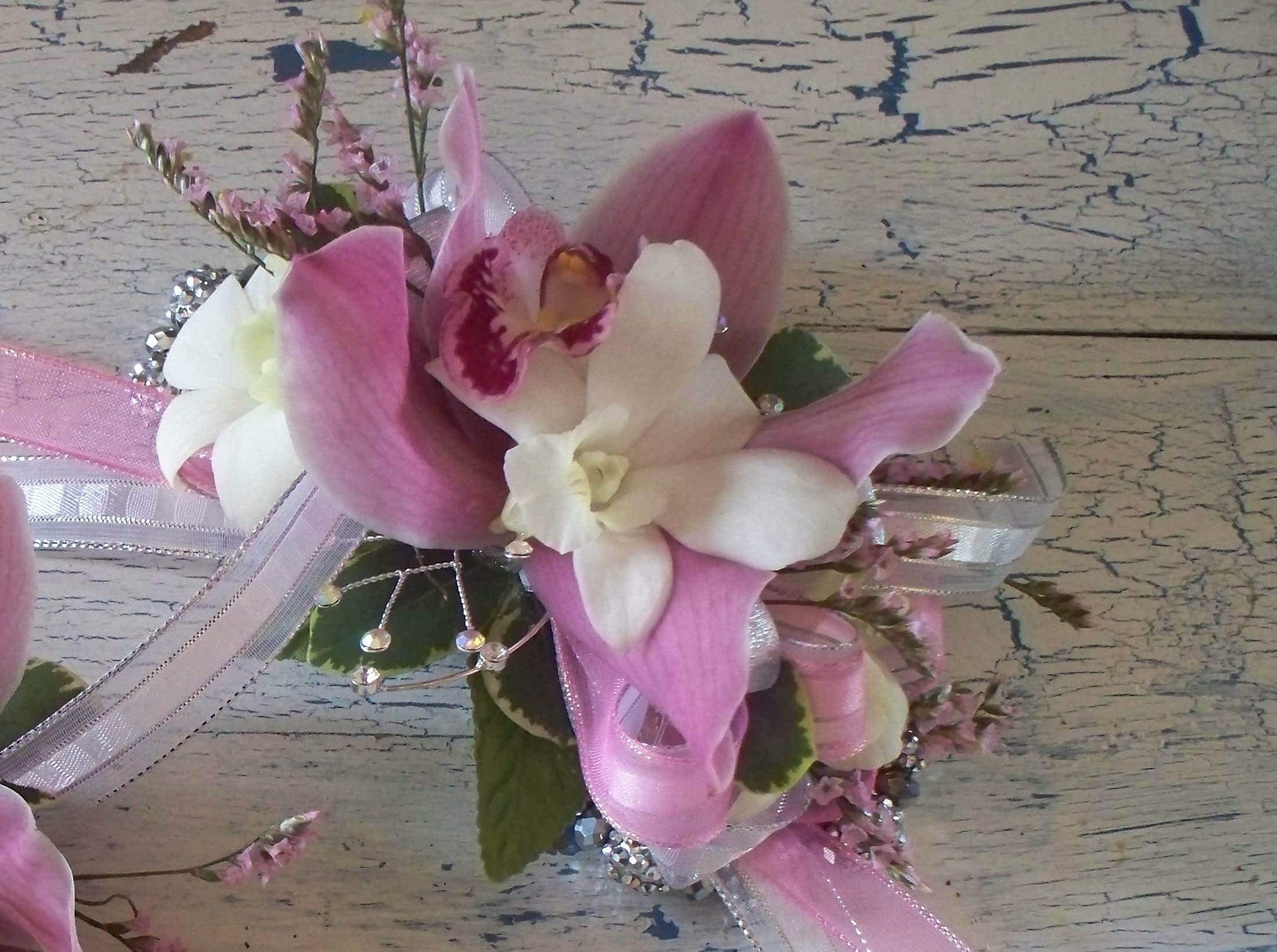 Pink and white orchid corsage with ribbon and rhinestone accents