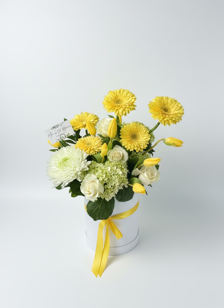 Yellow Sunshine - A radiant all-yellow arrangement bursting with cheerful energy, Yellow Sunshine features vibrant gerbera daisies, soft tulips, lush hydrangeas, and classic roses. Designed to feel warm and uplifting.