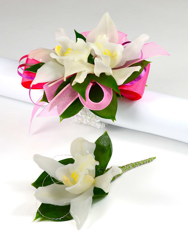 Posh Pink (Set) - Miniature cymbidium orchids are a long lasting elegant choice for wrist corsages. Price includes both the wrist corsage and boutonniere. Please note the dress and jewelry color in special instructions. Thank you.