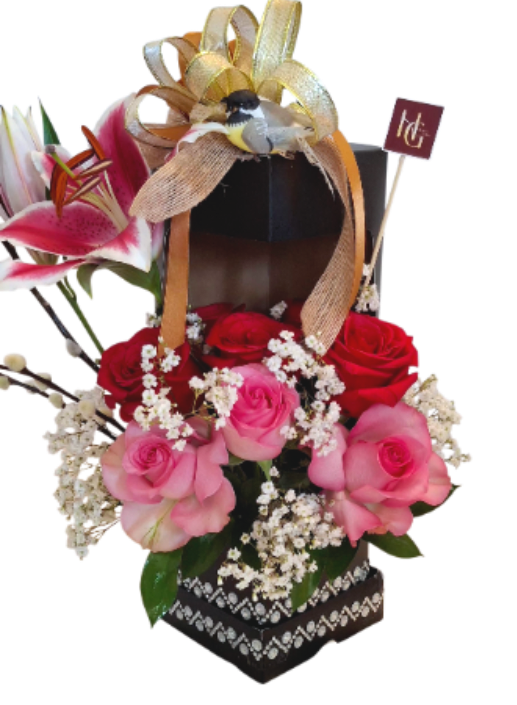 The Songbird Muse Arrangement  - A poetic expression of beauty. This sophisticated tall box, adorned with sparkling accents, features a lush nest of premium red and pink roses, delicate baby's breath, and a striking stargazer lily. Topped with a charming songbird and a golden bow, it's a unique work of art for a mother who inspires.