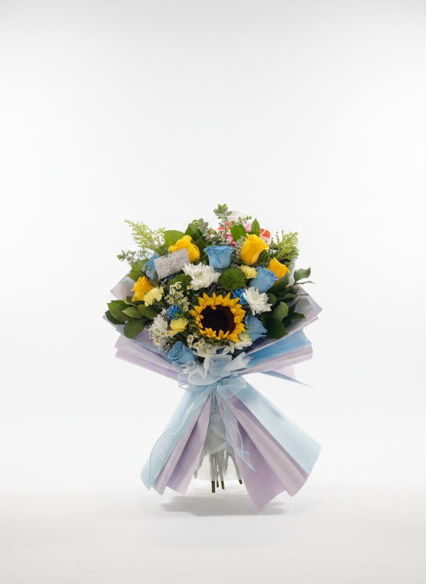 Blue Princess - Blue Princess has touches of blue and yellow roses, with white chrysanthemums and chamomile to give it a magical and whimsical feel. Wrapped in shimmering baby blue wrapping, perfect for any princess celebrating a special moment. 