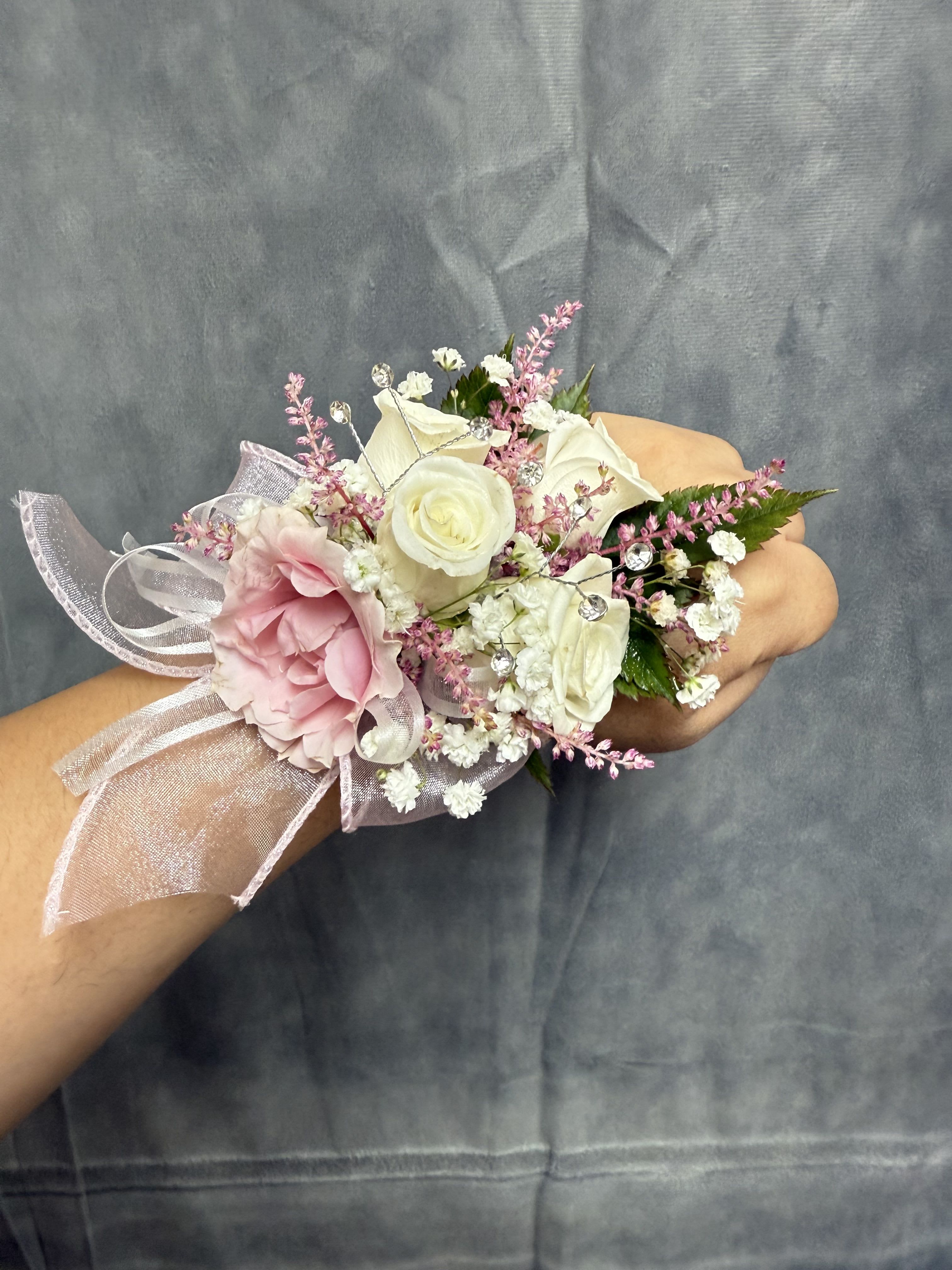 White pink spray roses corsage - White and blush pink spray roses with white fillers, sheer pink ribbon and sparkling crystal picks with pearl wrist corsage perfect  for proms.