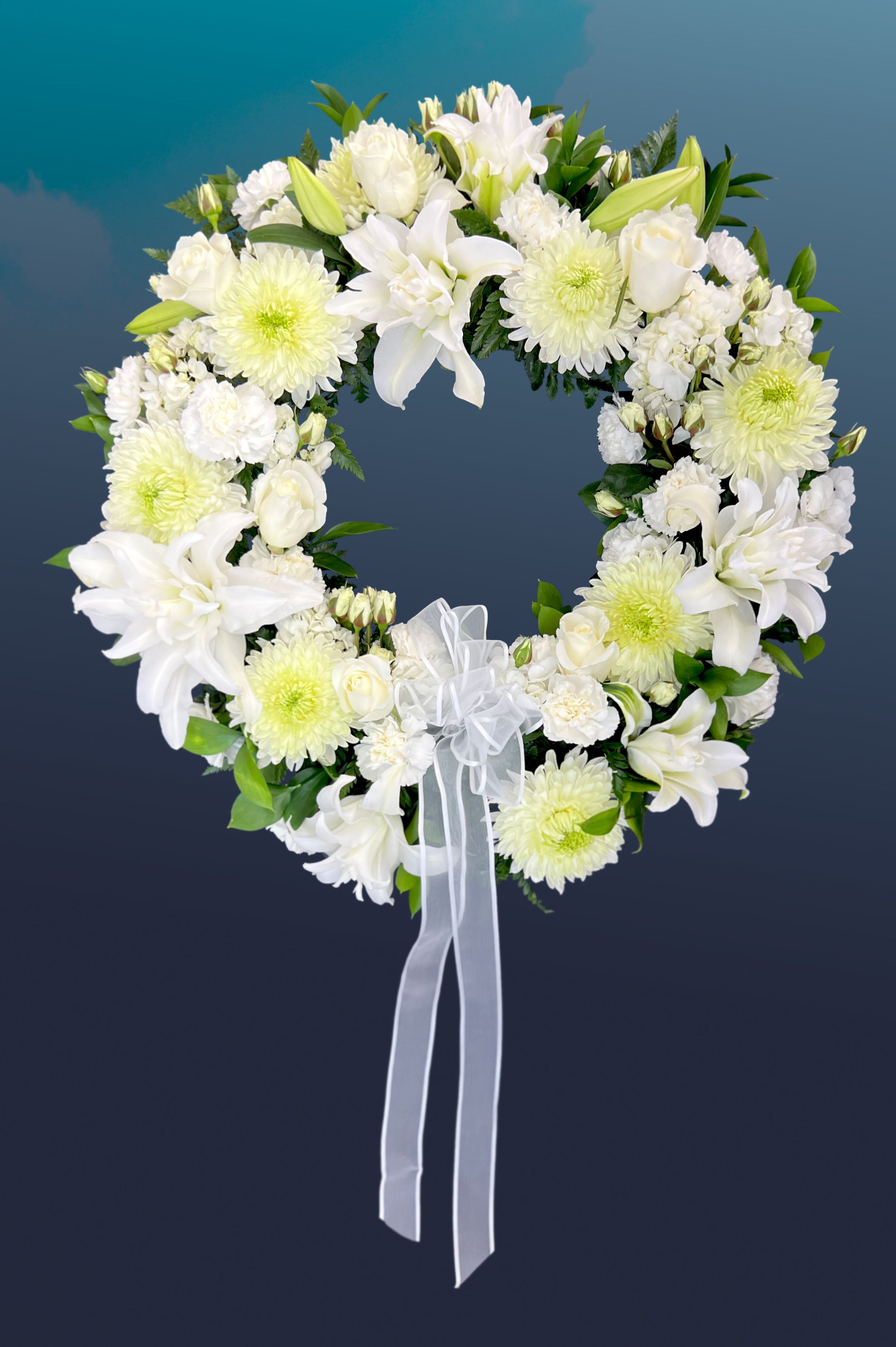 Treasured Tribute Wreath -  Bright white roses, asiatic lilies, carnations, and mums.