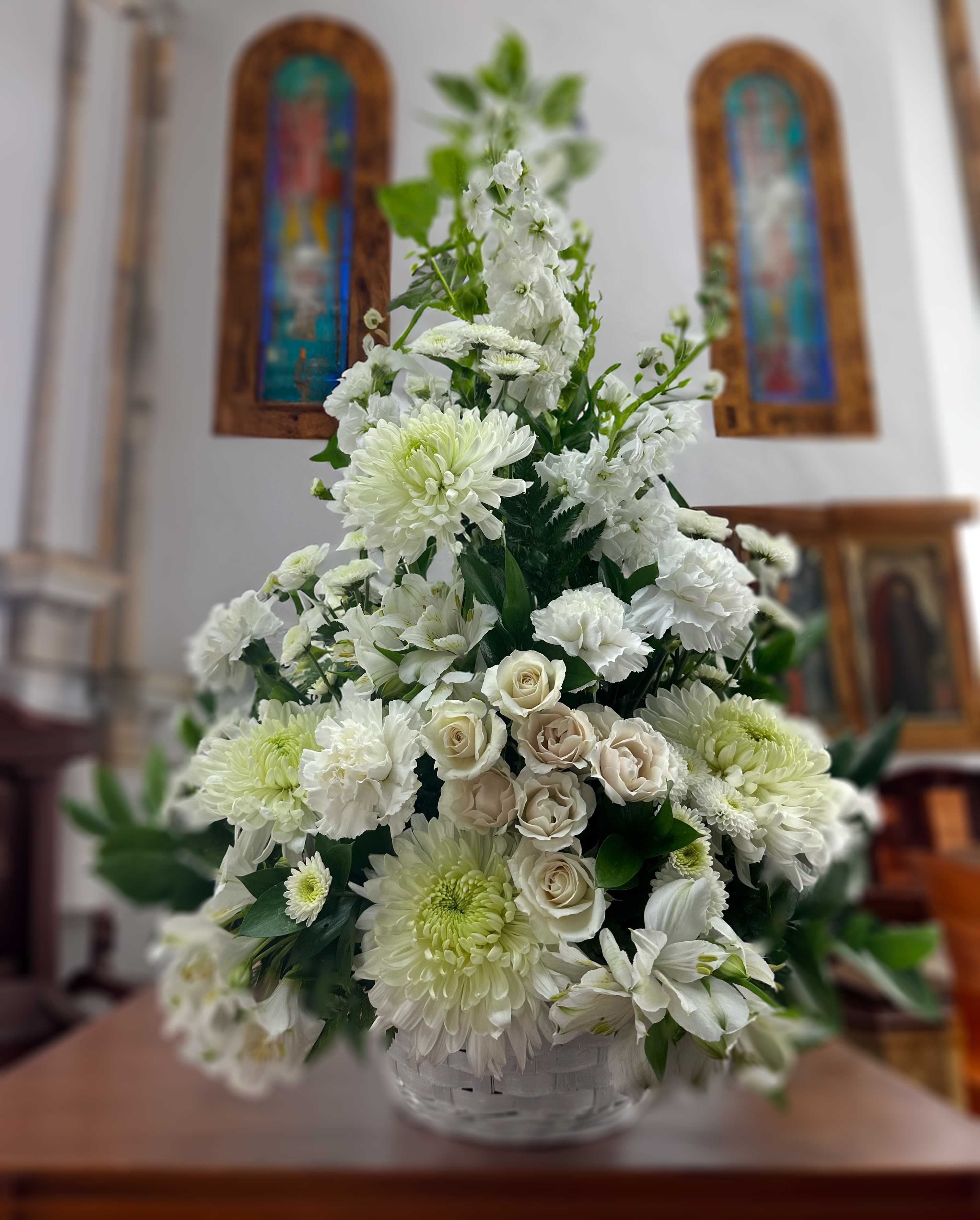 Eternal Affection - A lovely offering of genuine sympathy. Composed of chrysanthemum, alstroemeria carnations, mini carnations and lush greens. 