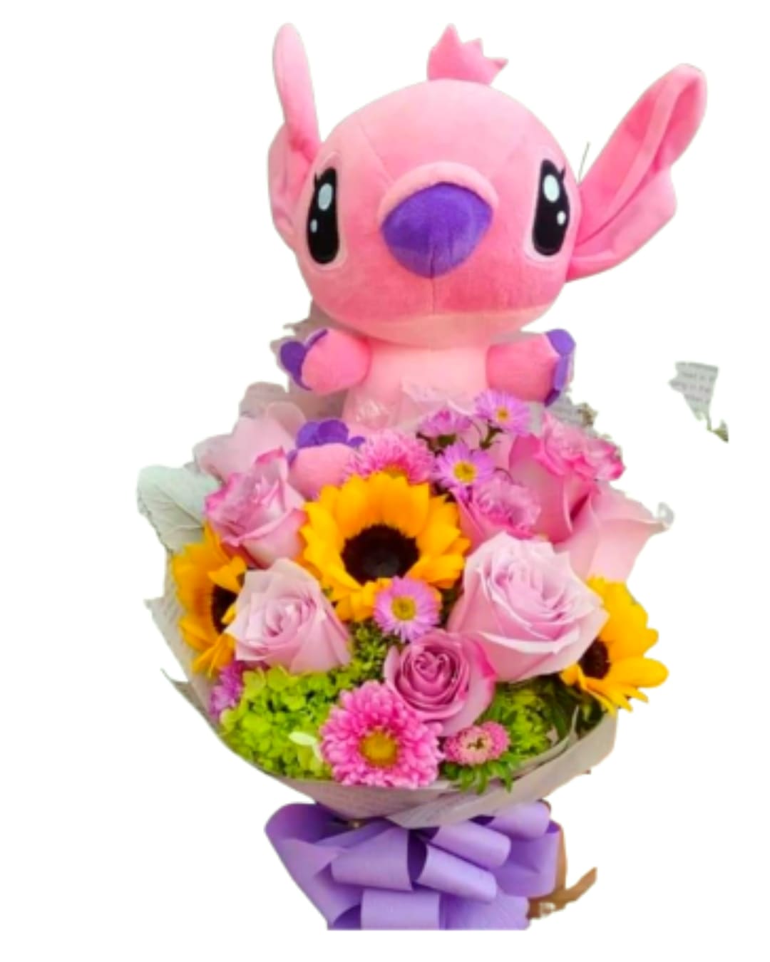 The Sweet Angel Harmony - The Galactic Bloom Bouquet is a bright and airy celebration of color. This stunning handcrafted arrangement features golden sunflowers and premium lavender roses, nestled among vibrant spring pompons and lush greenery.