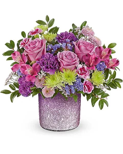 Pink and purple mixed bouquet in a glittery lavender vase