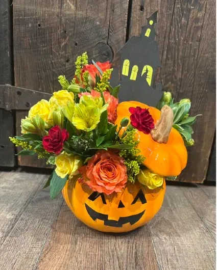 Trick-or-Treat Fall - This whimsical arrangement features seasonal blooms in presented in a ceramic pumpkin-shaped vase. It's the perfect way to celebrate spooky season!