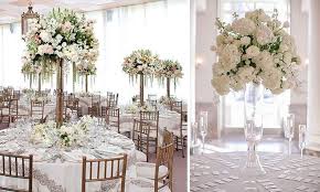 Elegant Event Centerpiece - A stunning tall floral centerpiece designed to elevate any special event, including weddings, quinceañeras, and graduations. Featuring fresh, elegant blooms in soft tones and arranged on a tall stand, this piece adds sophistication, height, and a luxurious touch to your celebration. Perfect for creating a memorable and refined atmosphere.