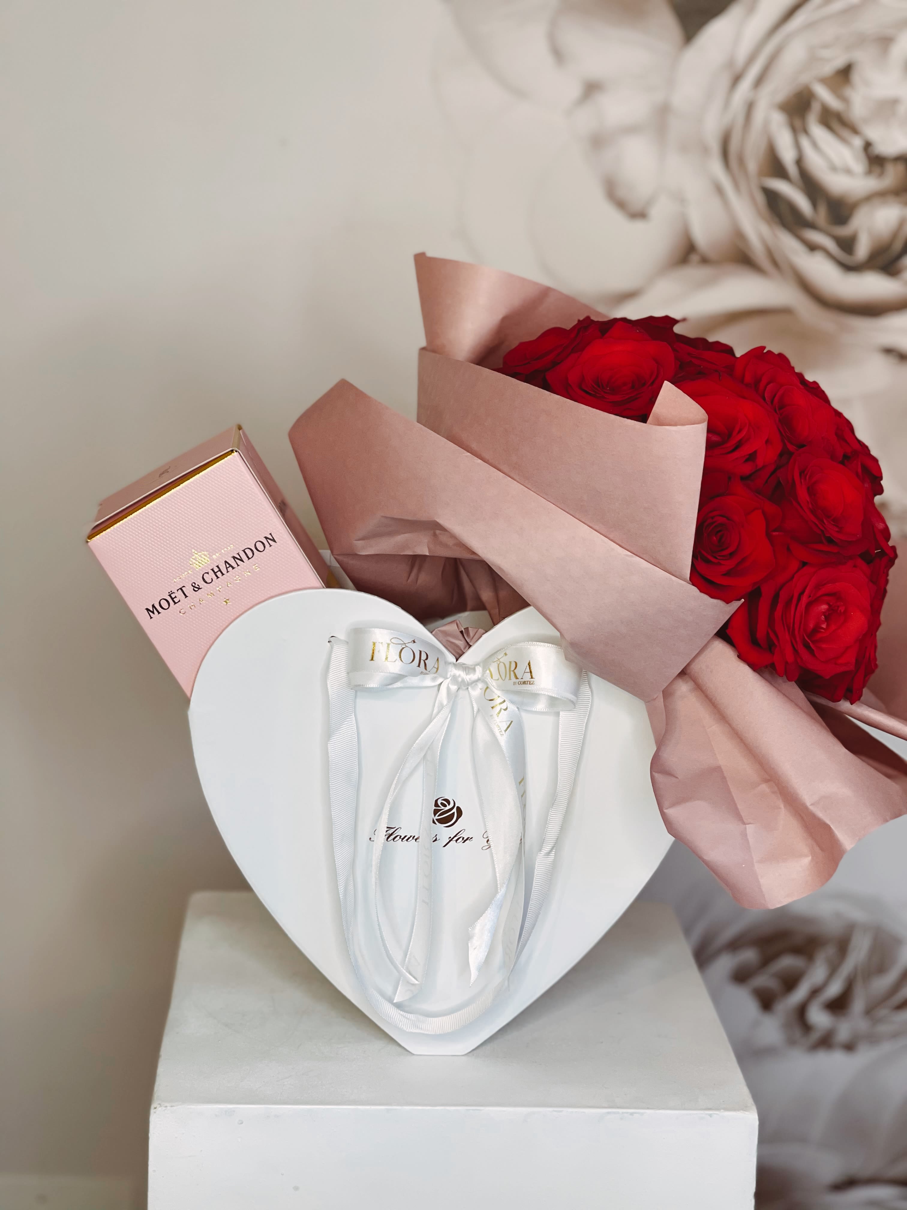 Red rose bouquet with a pink champagne box and white heart gift box