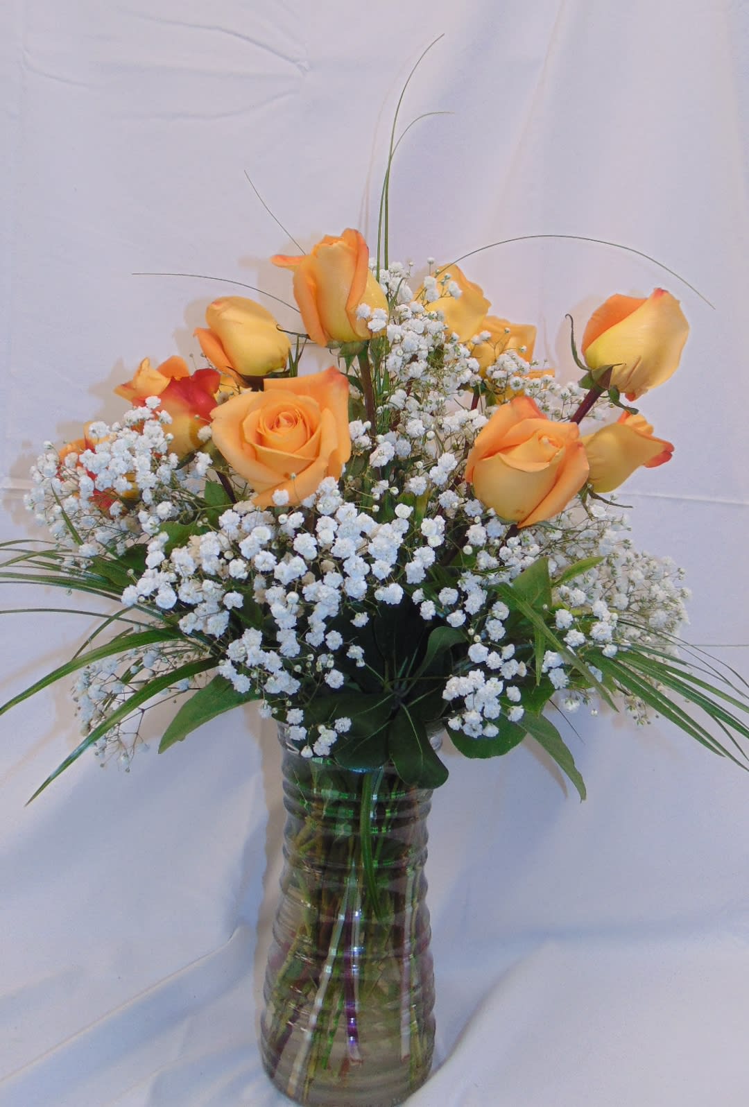 Dozen Orange Roses - Orange roses make the perfect summertime bloom. Unique and vibrant, these tangerine blossoms have a way of bringing an invigorating energy to any joyful summer occasion. The perfect mix of contemporary and classic, this relatively new rose variety is a gift that is sure to light up someone’s day. If you would like 2 doz roses please select premium.