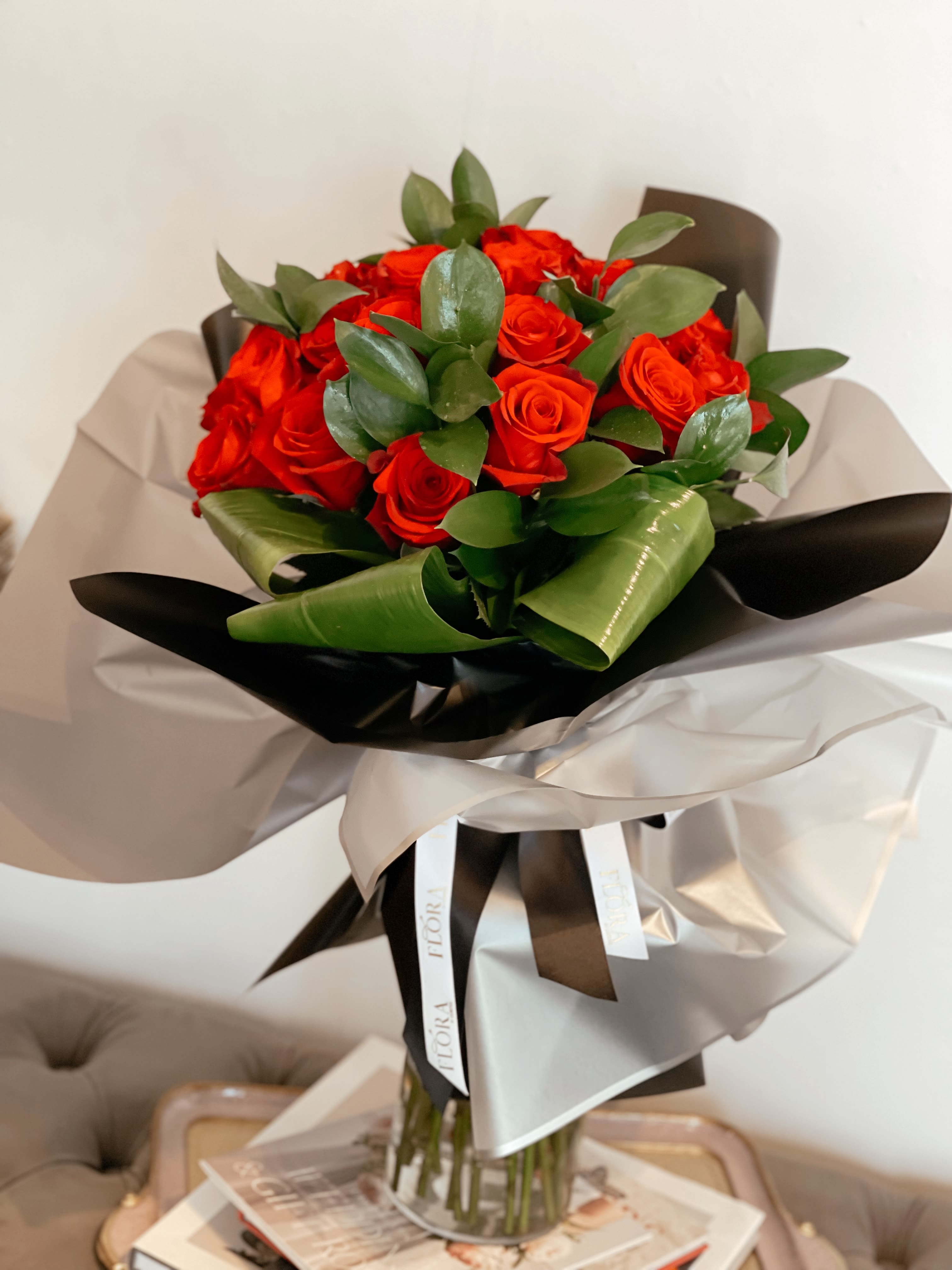 Rose Bouquet - Elegantly arranged 25 rose bouquet, perfect for any occasion. Whether for a special celebration or a thoughtful gesture, our fresh, vibrant roses are carefully selected to create a stunning display. Available in a variety of colors and styles, this timeless bouquet is sure to impress and convey your heartfelt emotions.