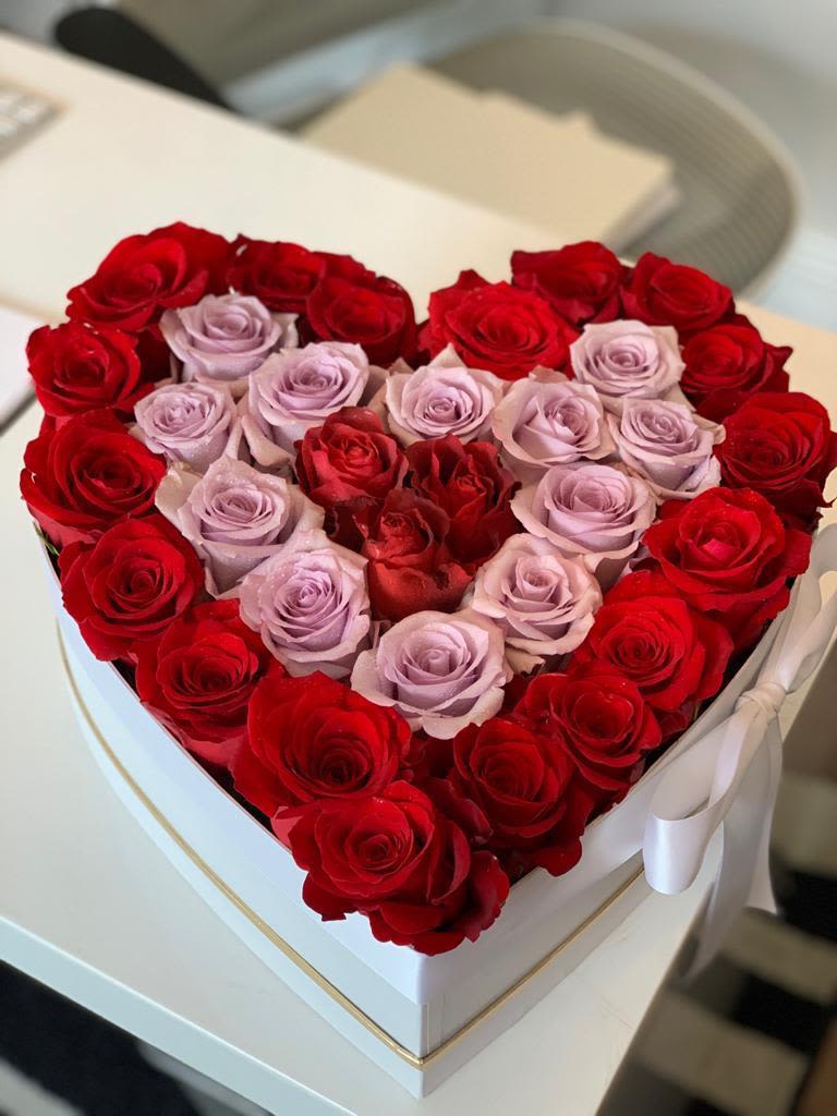 THE DEVOTION - Express your love with a romantic heart-shaped approximatley 35 Rose floral arrangement, available in red, red &amp; purple, gold, and blue. A beautiful mix of fresh blooms, perfect for anniversaries, Valentine's Day, or any special occasion. Order this elegant and thoughtful bouquet today!
