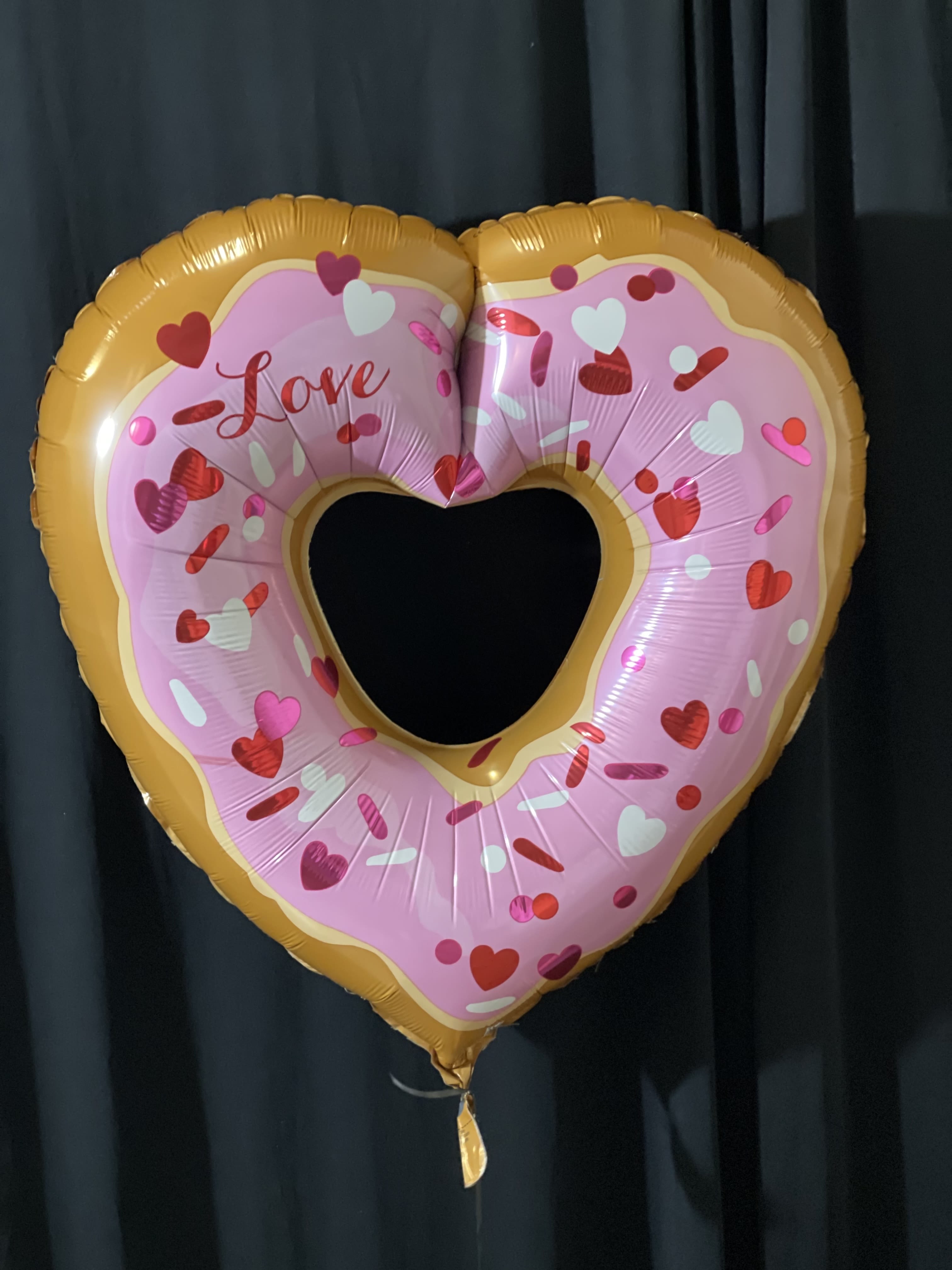 26-Inch Supershape Donut Balloon in Heart Shape – Fun &amp; Unique Decoration - Celebrate with a twist using our 26-Inch Supershape Donut Balloon in a heart shape! Perfect for birthdays, anniversaries, and special occasions, this fun and unique balloon combines sweetness and love for a memorable decoration. Shop now for a delightful and creative touch to your event!