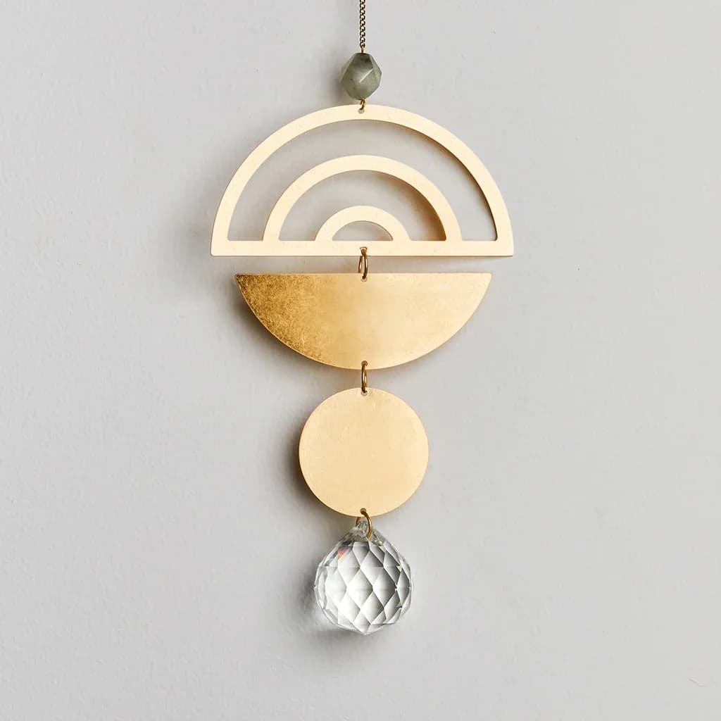 Geometric gold metal hanging ornament with clear faceted crystal drop