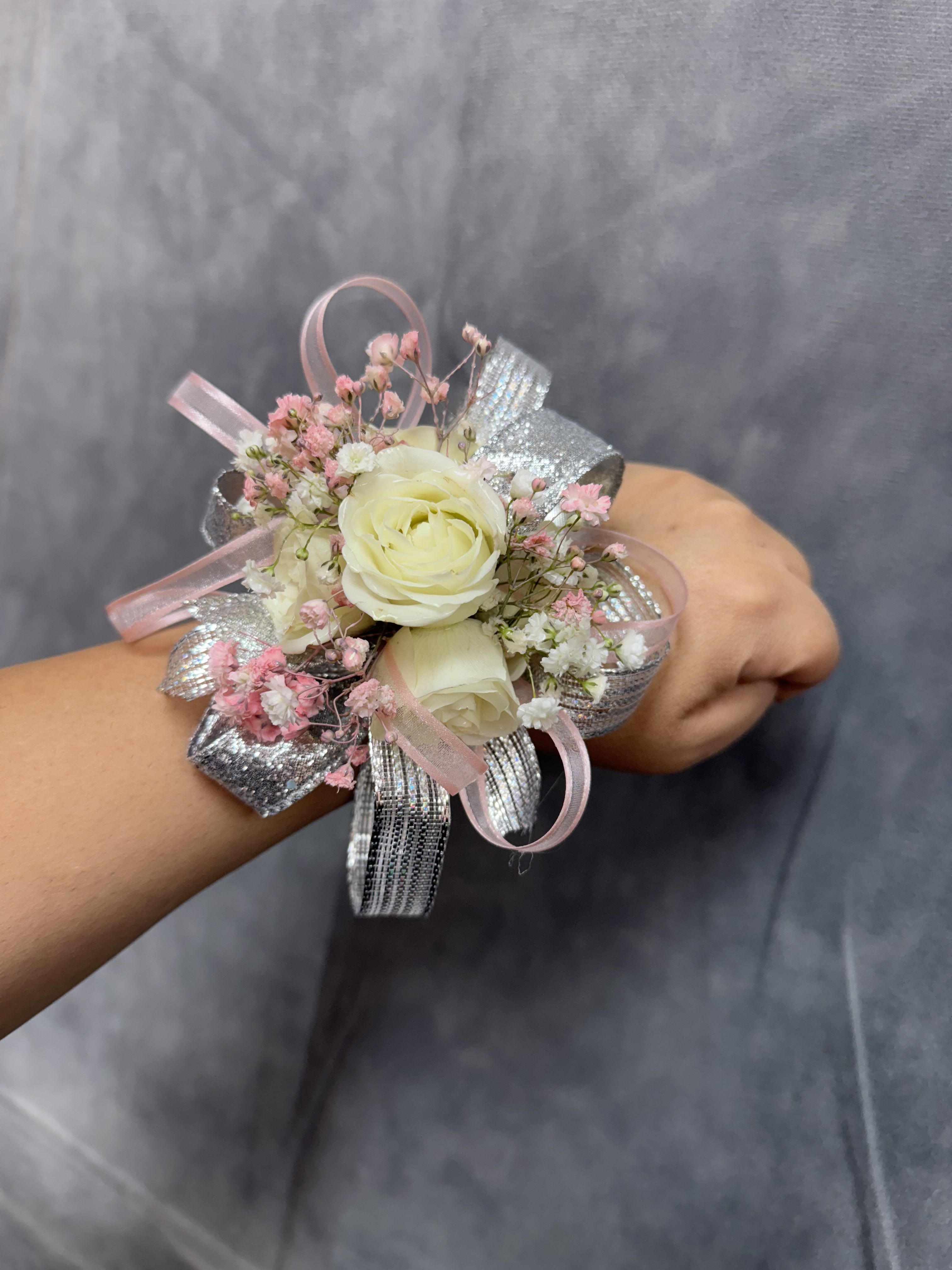 White silver pink corsage - White spray  roses with delicate pink fillers, finished with silver and pink ribbon with pearl band corsage 