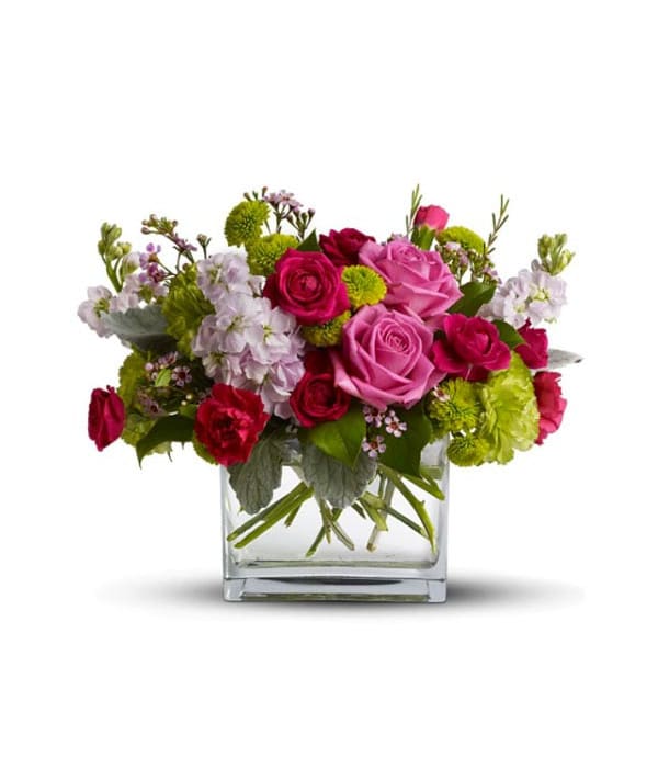 Pink and red roses in a clear glass vase