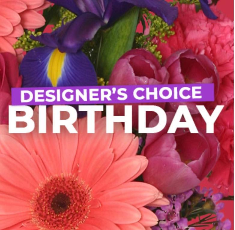 Bright mixed bouquet with a large pink gerbera and purple iris, overlaid with birthday text