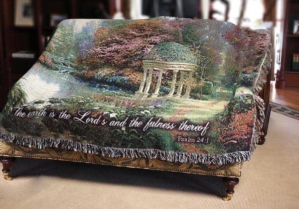 Garden of Prayer - Share a message of faith, beauty, and encouragement with this Psalm 24:1 woven tapestry, featuring a peaceful garden scene and the scripture, “The earth is the Lord’s and the fullness thereof.” A meaningful piece that offers comfort, inspiration, and a steady reminder of God’s presence through every season of life.  Designed to be both displayed and kept, this tapestry works beautifully as a gift for birthdays, encouragement, thinking of you, housewarmings, get well wishes, or any moment when someone needs a reminder they are not alone.  It also serves as a striking and thoughtful display for memorial services or celebrations of life, offering a message that feels both grounding and lasting.  A piece to hold onto, reflect on, and return to—long after the moment has passed.  Available for local gift and sympathy delivery through Aspen Tower Florist, serving Shelbyville and Greensburg along with Rushville, Hope, Batesville, Westport, Oldenburg, St. Paul, Waldron, and Milroy.