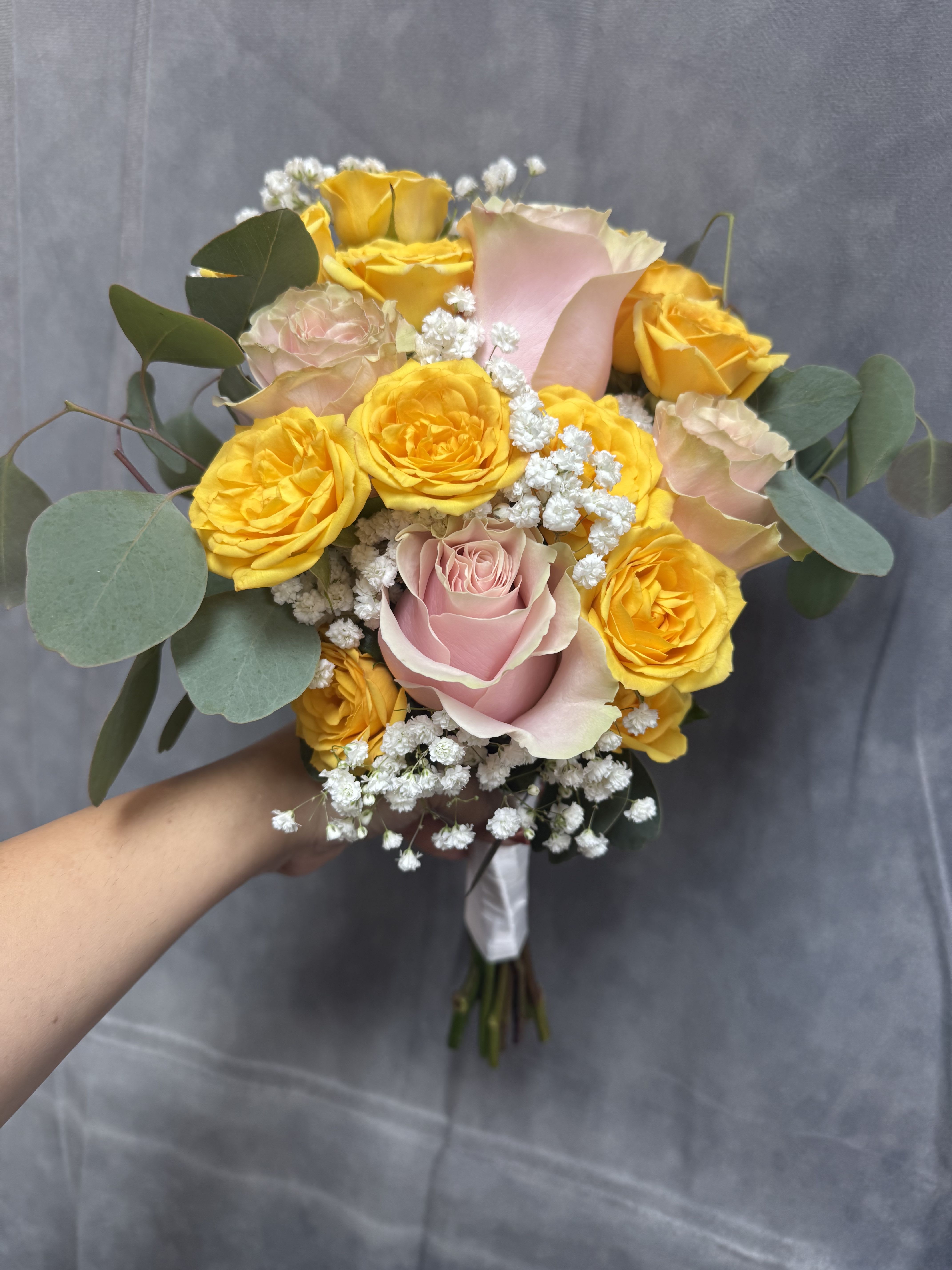 Golden blush prom bouquet  - Bright yellow spray roses and  blush-pink roses with white fillers and greenery , hand-tied in a bouquet-cheerful, perfect for prom