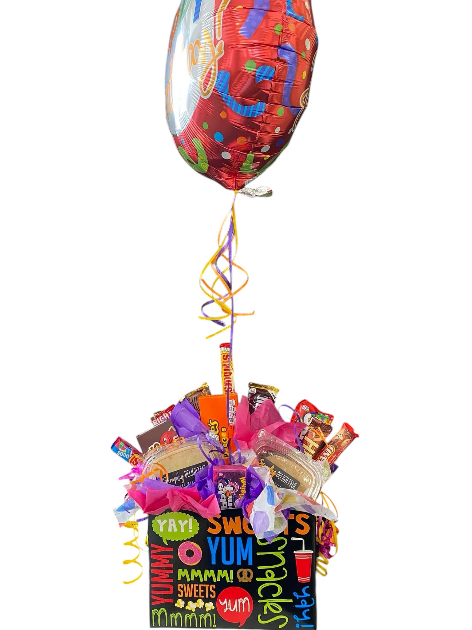 Candy gift basket with a birthday balloon and colorful ribbons