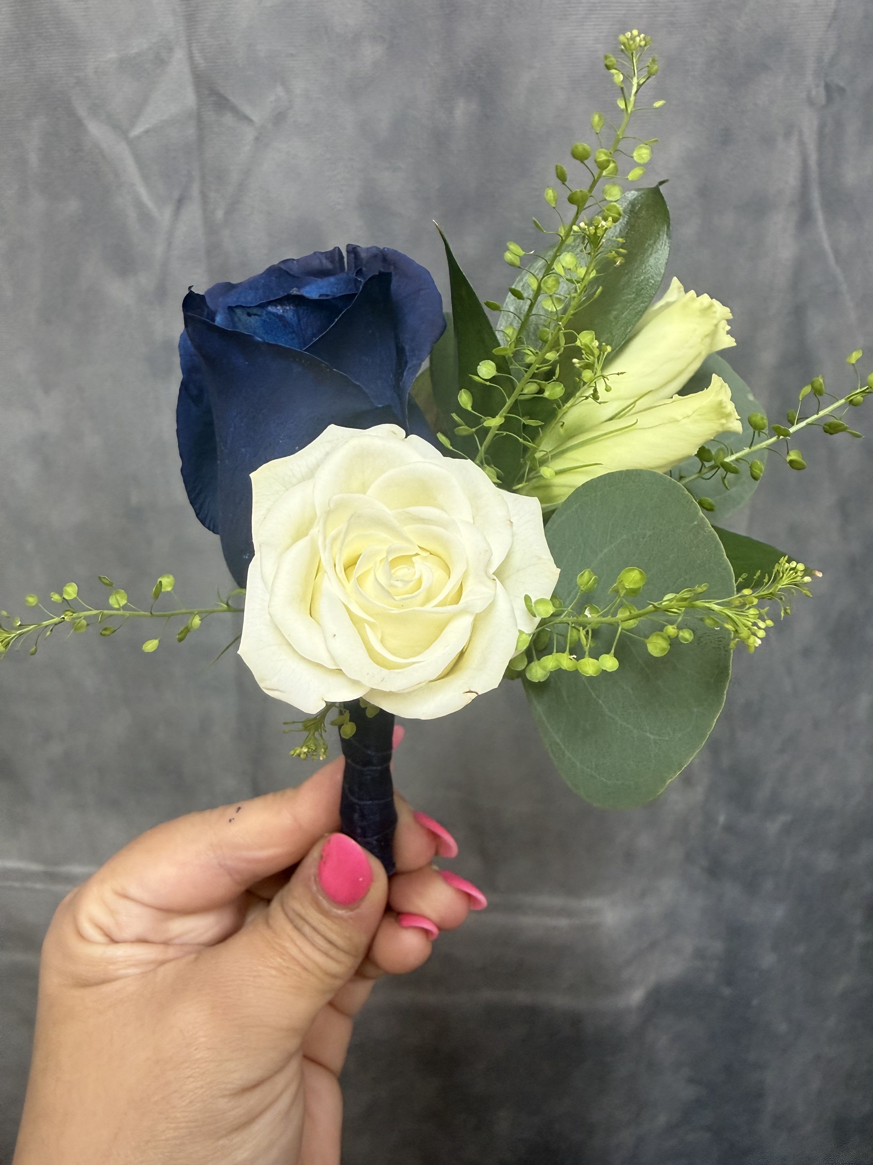 Navy white boutonnière  - White spray rose , lisianthus and navy  rose with green accents and eucalyptus leaves, hand-wrapped stem for a compact, elegant boutonniere