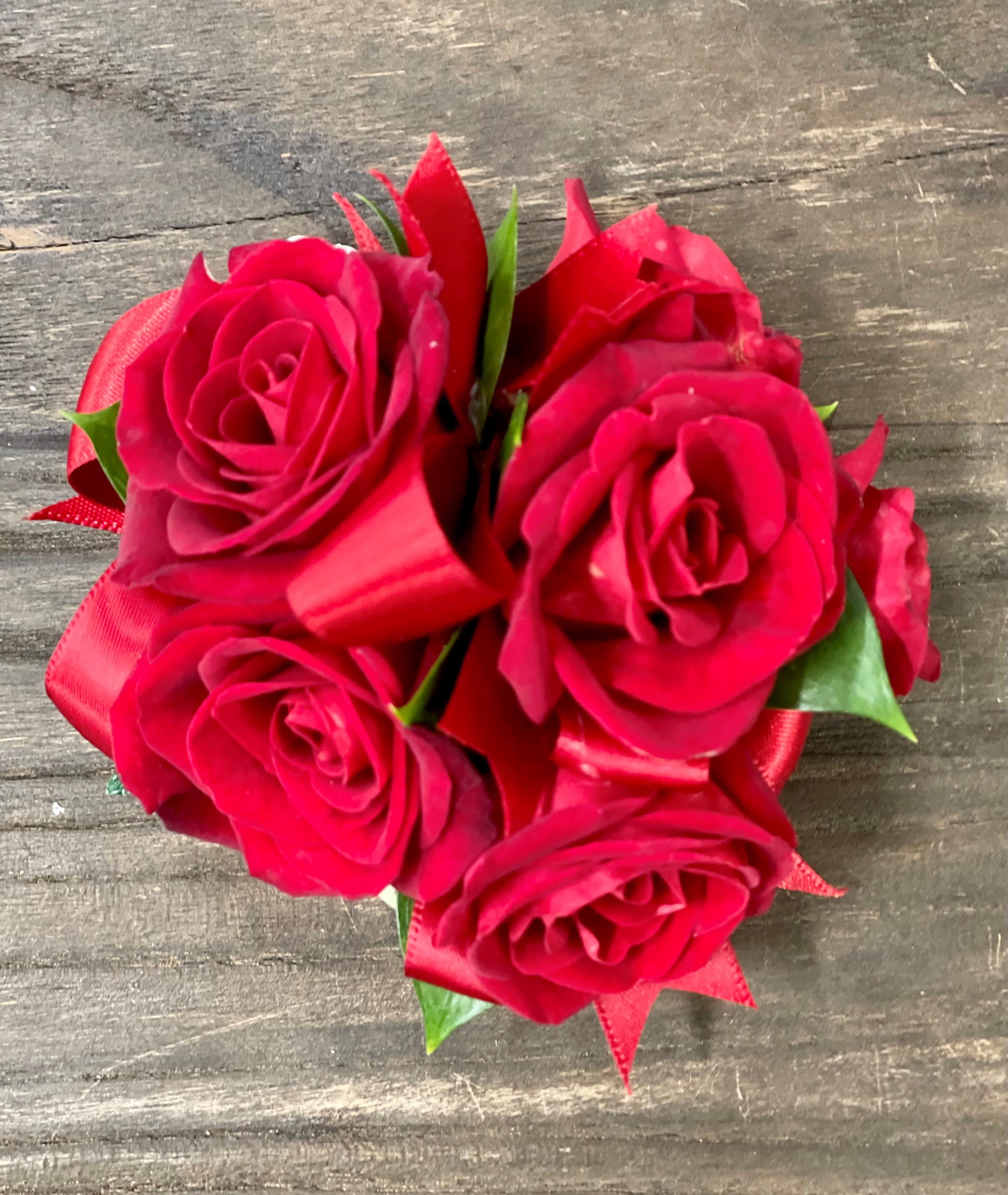 Small bouquet of red roses with ribbon wrap