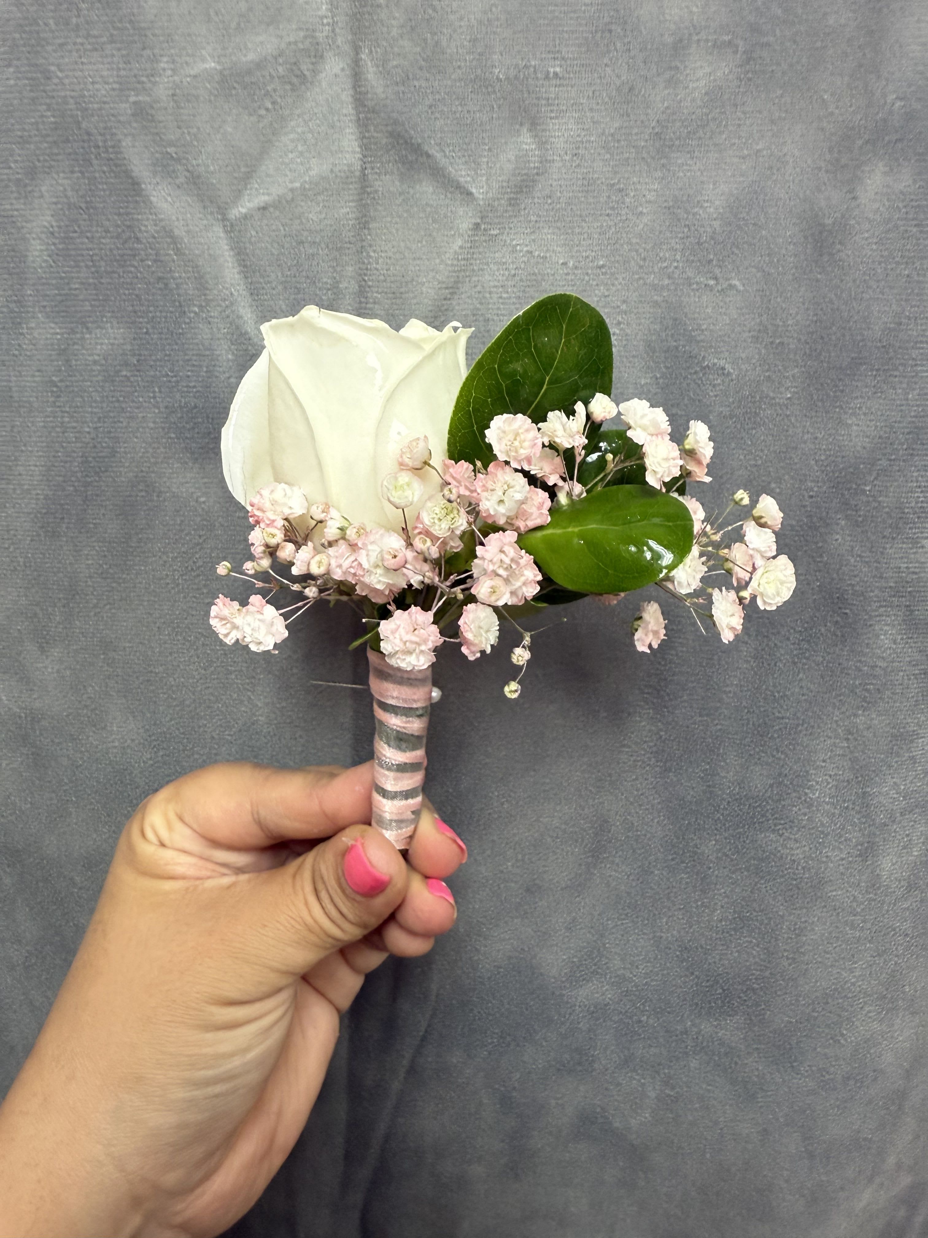 White pink boutonnière  - White rose boutonnière with pale pink baby's breath and glossy green leaves