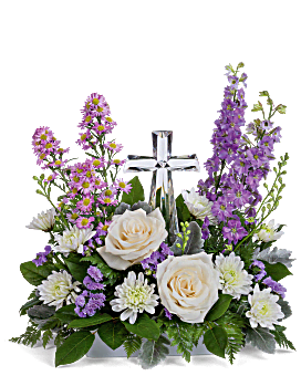 Eternal Light Tribute - A graceful sympathy arrangement featuring a radiant crystal cross surrounded by elegant white roses, soft lavender blooms, and fresh greenery. This serene design symbolizes faith, peace, and everlasting love—offering comfort and a beautiful reminder of a life cherished and never forgotten.