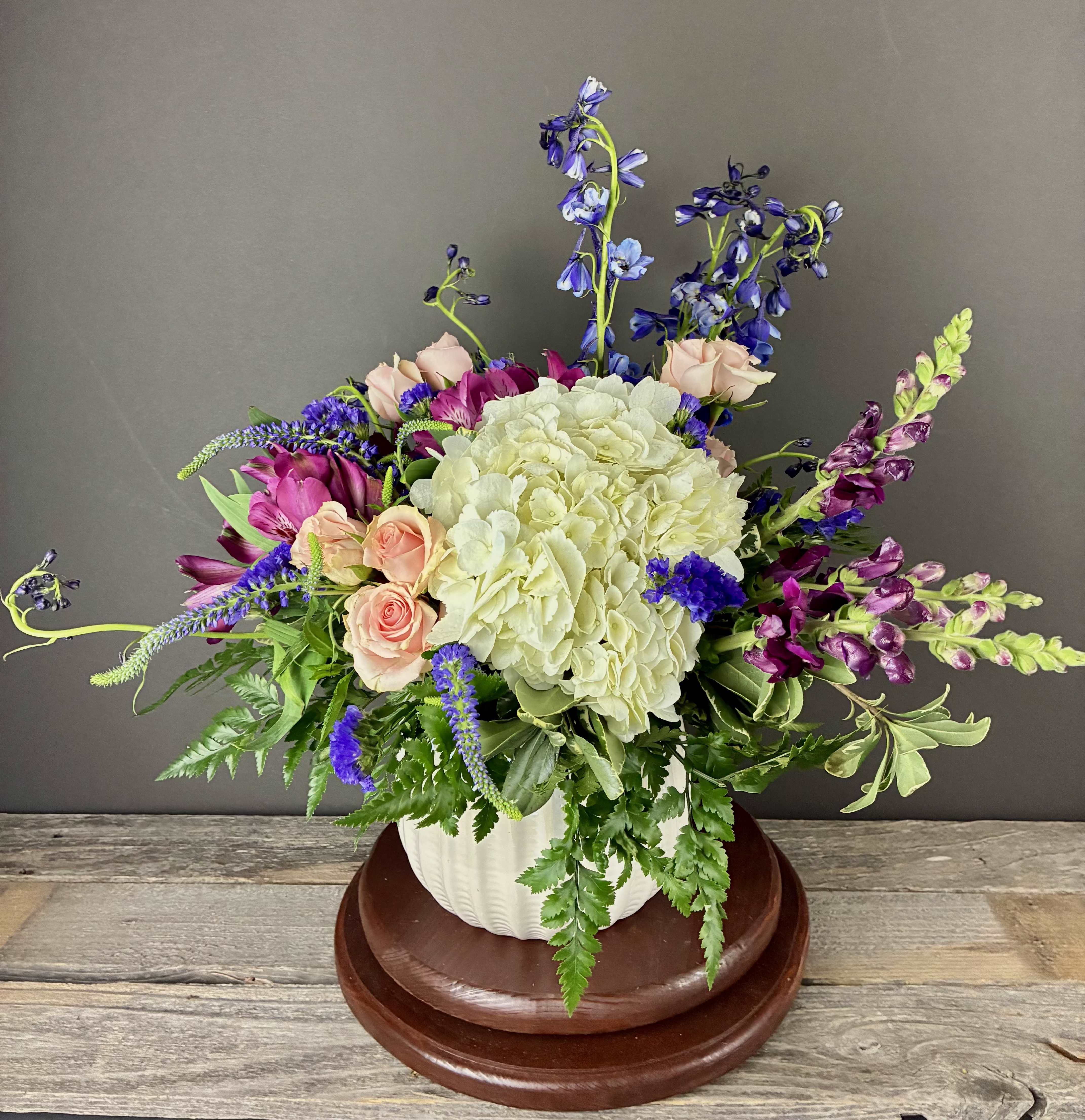 Spring Rain - Our Spring Rain arrangement features flowers in shades of blue and purple that evoke the feelings of a rainy spring day.
