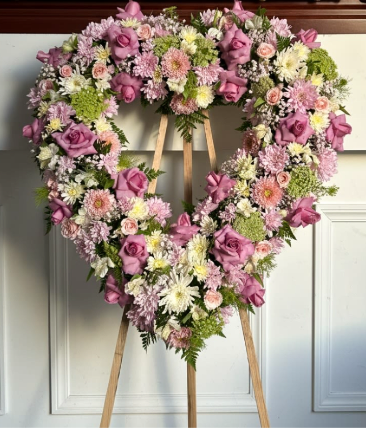 Blushing Heart - A soft and graceful heart-shaped arrangement designed with delicate blush and ivory blooms, including roses, chrysanthemums, and airy filler flowers. Blushing Heart expresses love, remembrance, and tenderness, offering a beautiful and heartfelt way to honor someone special.