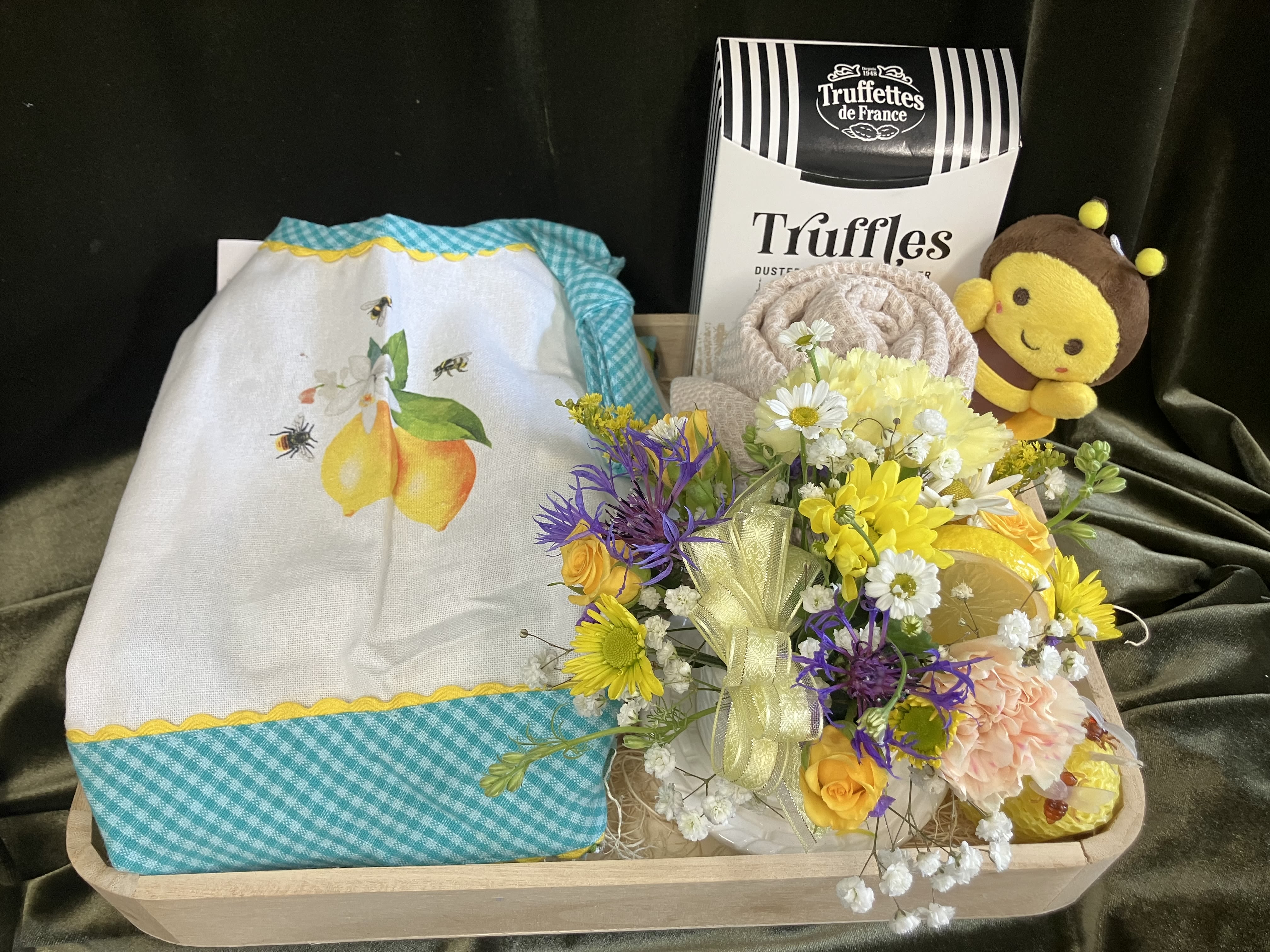 Flowers and Gifts  - Assorted items for a unique gift, includes serving tray, chocolates, fresh flowers, hand towel, sweet apron, and a beeswax candle!