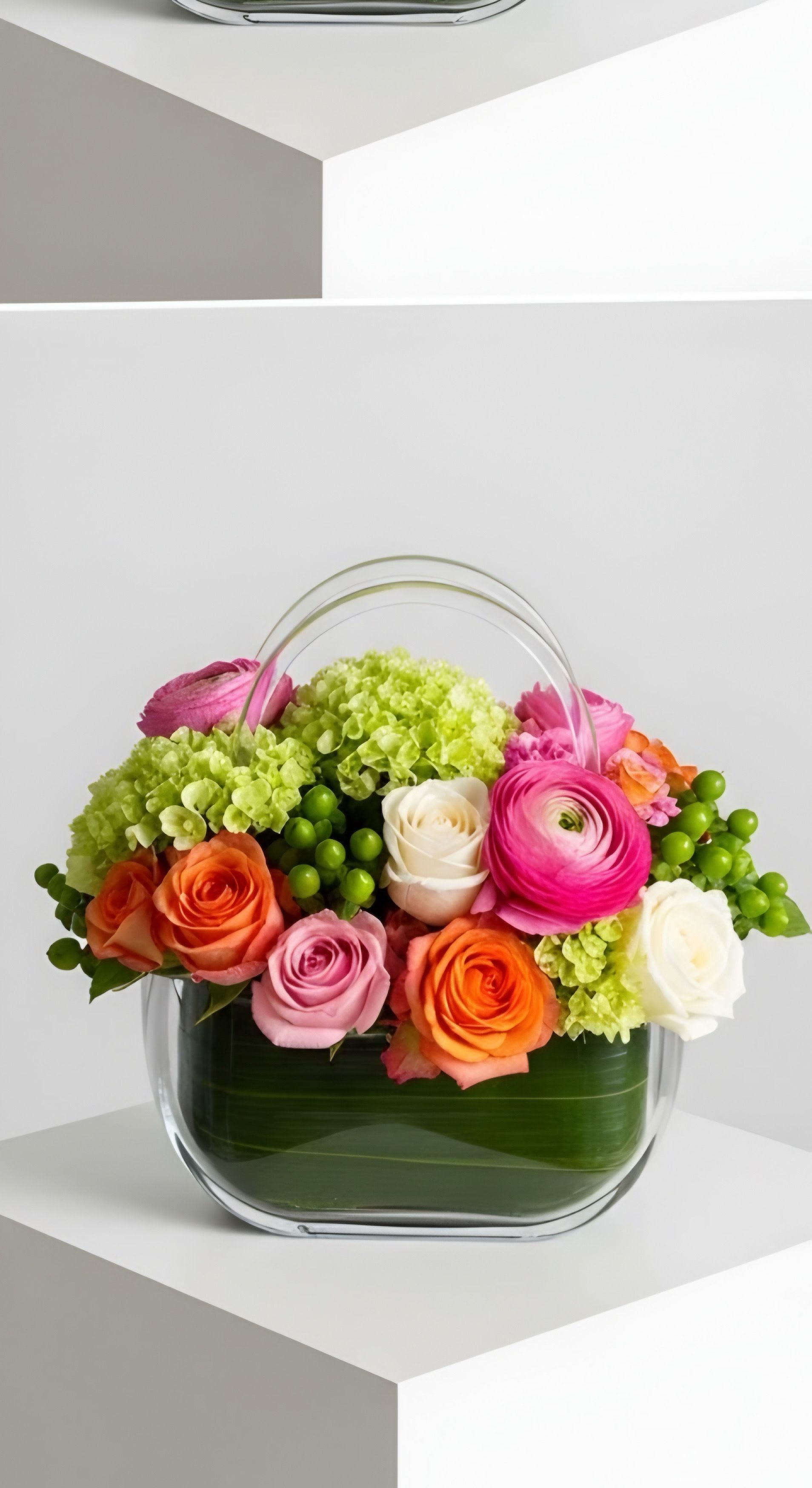 Citrus Glow Purse - A Boutique Bouquet for the Best Mom Why settle for a standard vase when you can gift a piece of floral fashion? Our Citrus Glow Floral Purse is inspired by high-end design, blending the elegance of a boutique handbag with the natural beauty of a spring garden. Meticulously arranged with velvety Ecuadorian roses, delicate ranunculus, and textured hypericum berries, this lush display radiates warmth and joy. It’s more than just flowers; it’s a conversation piece that celebrates her unique spirit. Order early to ensure delivery for Mother’s Day weekend!.