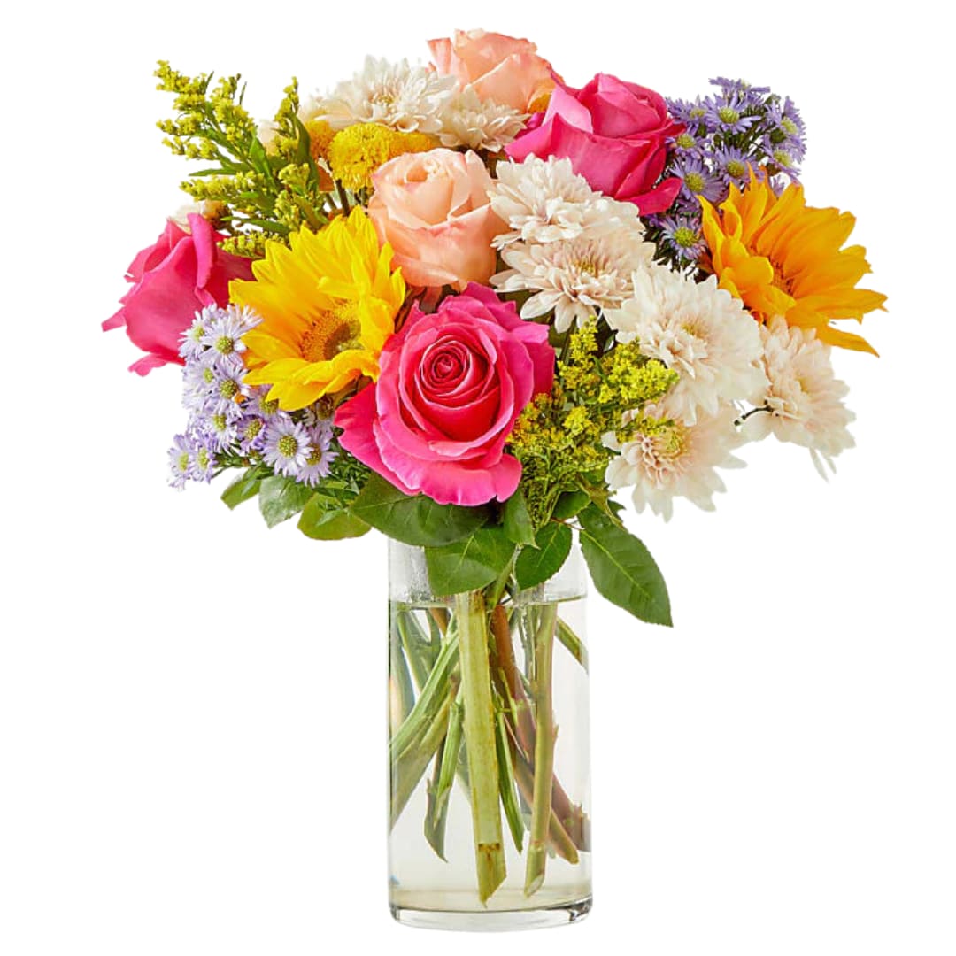 Sunny Delight  - This radiant floral arrangement brings together a striking mix of textures and colors that evoke warmth and cheer. Shimmer roses add a touch of elegance, their soft glow paired beautifully with the bold, sunny yellow of sunflowers. Yellow buttons provide a playful pop, complementing the rich, vibrant hot pink roses that inject a burst of energy into the mix. Together, these flowers create a joyful and lively display, perfect for brightening any room or celebrating a special moment with their captivating, sunny charm.