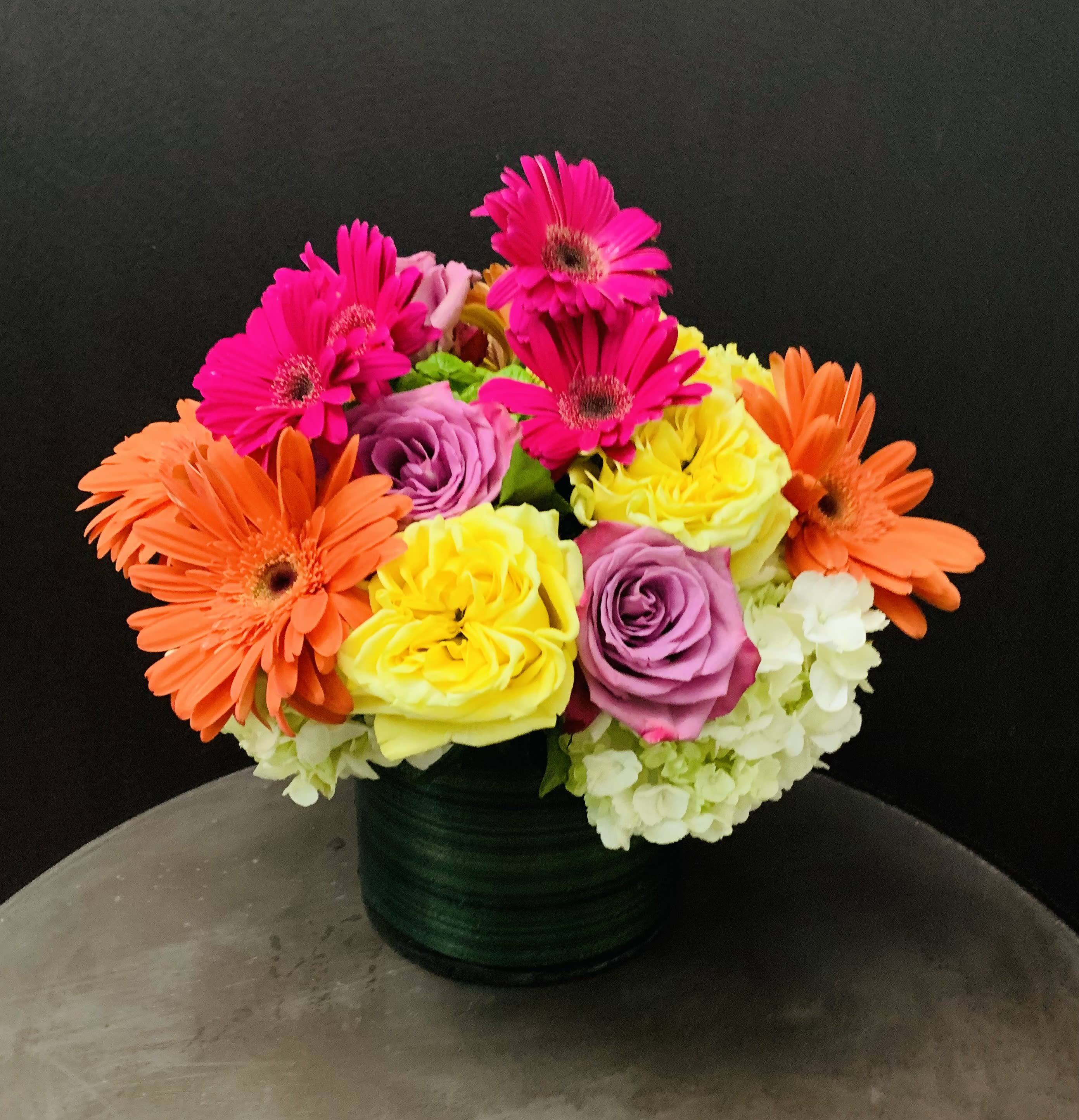 Summer Anticipation  - Roses, Gerberas, Hydrangeas in 6”x 6” glass Vase 
