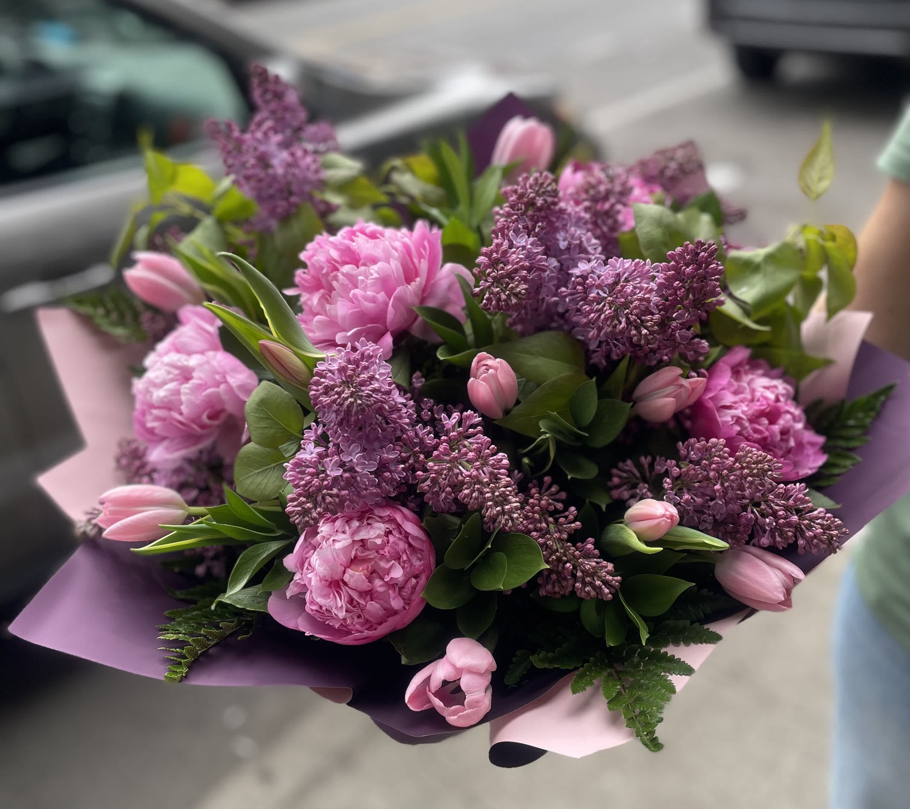 Lilac with peonies and tulips bouquet.  The photo shows a deluxe size. - The photo shows a deluxe size.